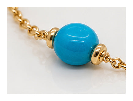 Turquoise bead and 18ct yellow gold spacer detail