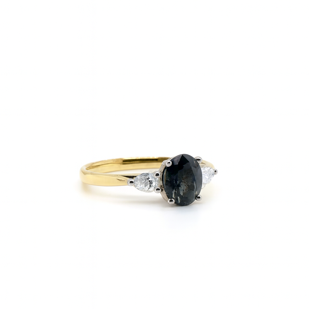 Oval cut Teal sapphire with pear diamonds