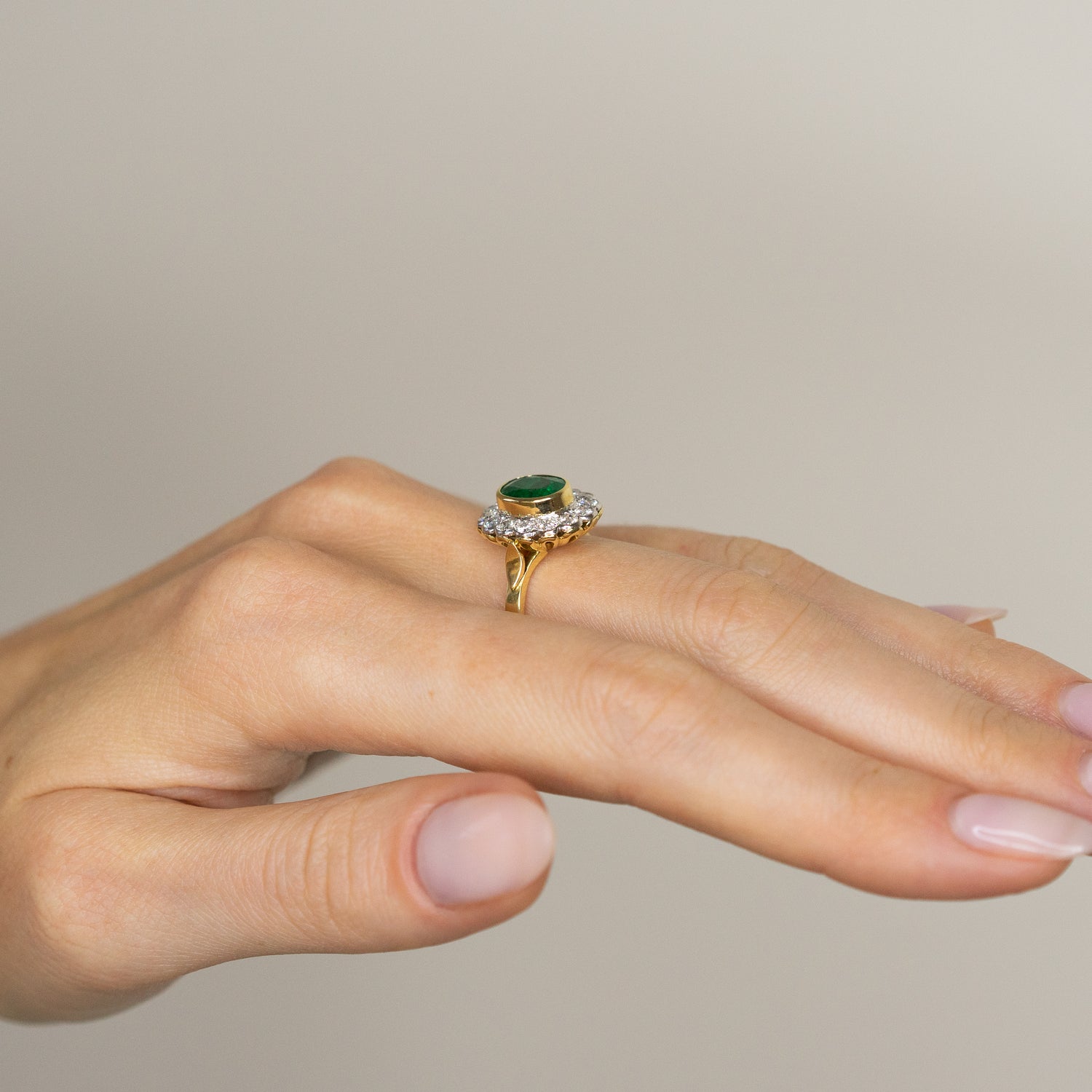 1.90ct Oval Emerald Ring with Bezel and Diamond Halo