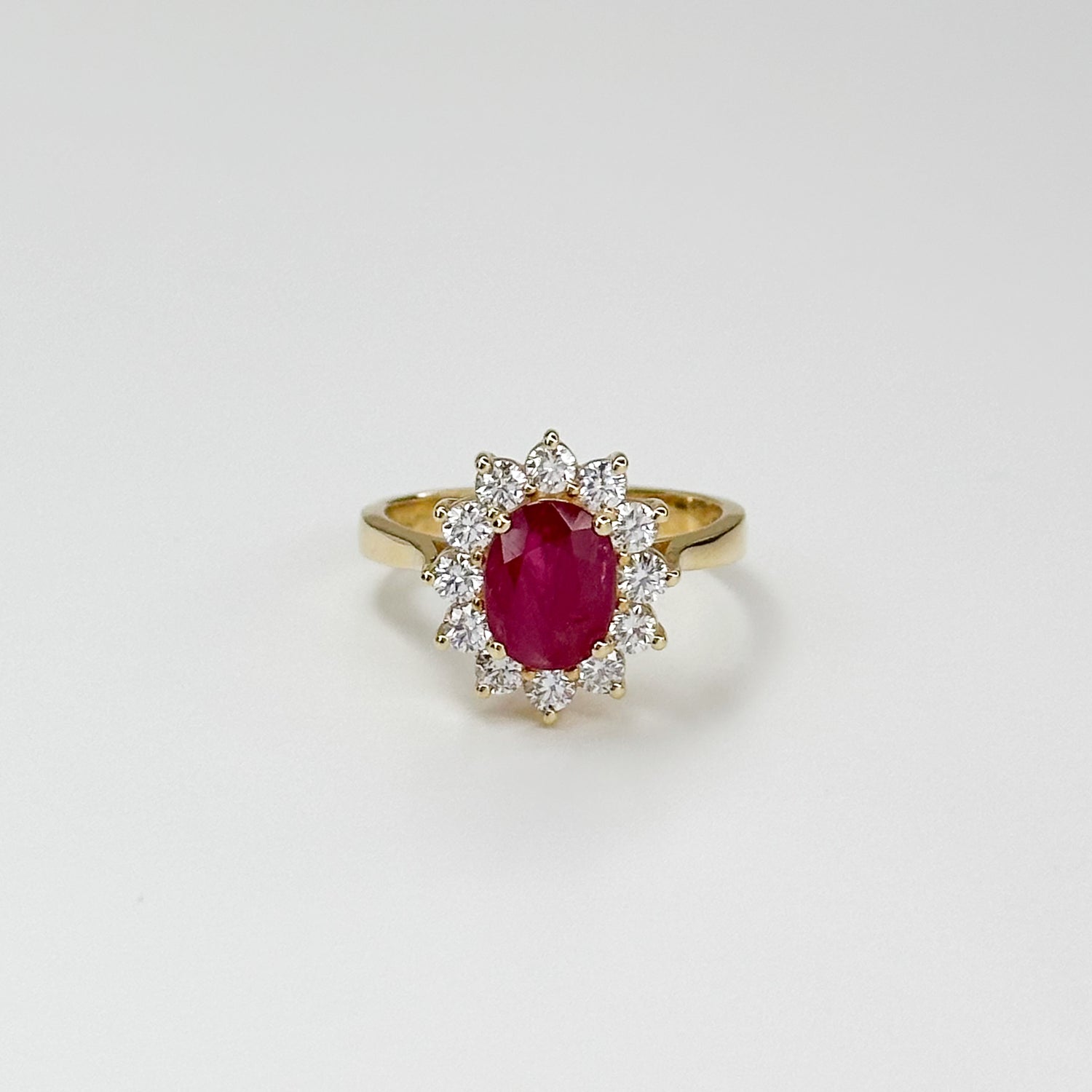 1.70ct Oval Cut Ruby Ring with Diamond Halo