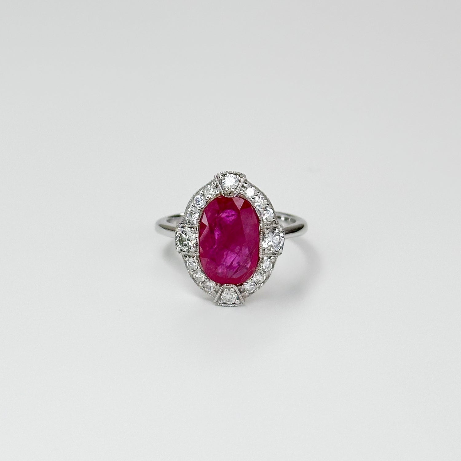 3.23ct Oval Cut Ruby Ring with Diamond Halo