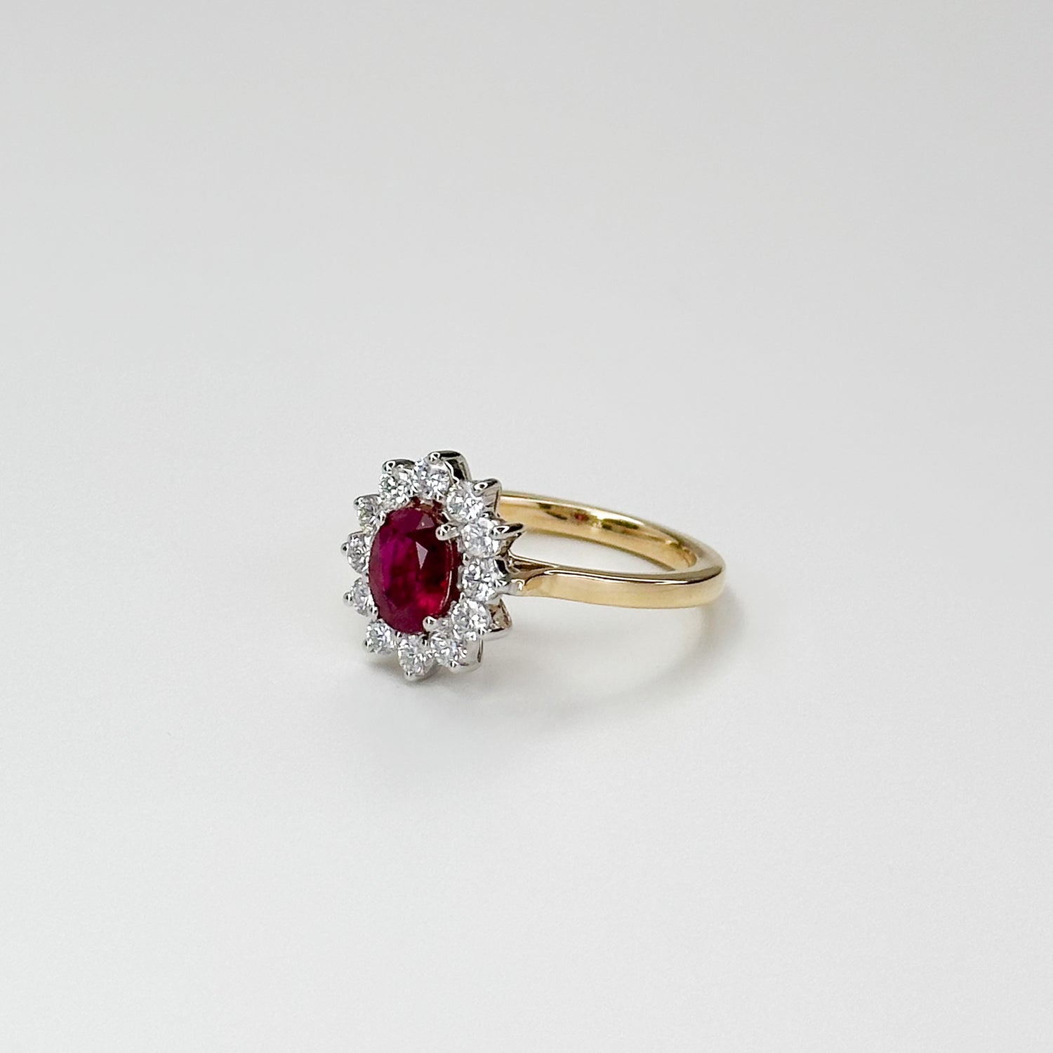 1.05ct Oval Cut Ruby Ring with Diamond Halo