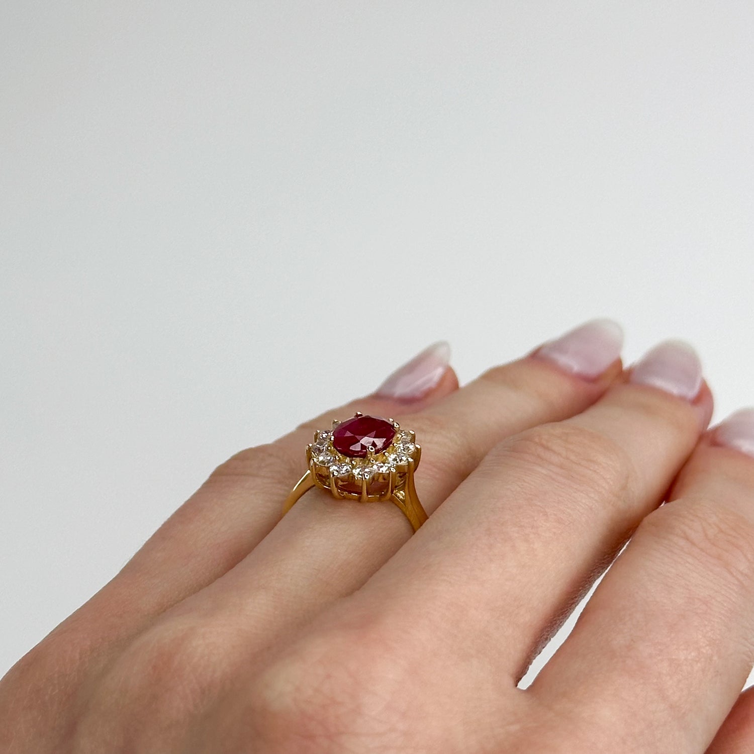 1.70ct Oval Cut Ruby Ring with Diamond Halo