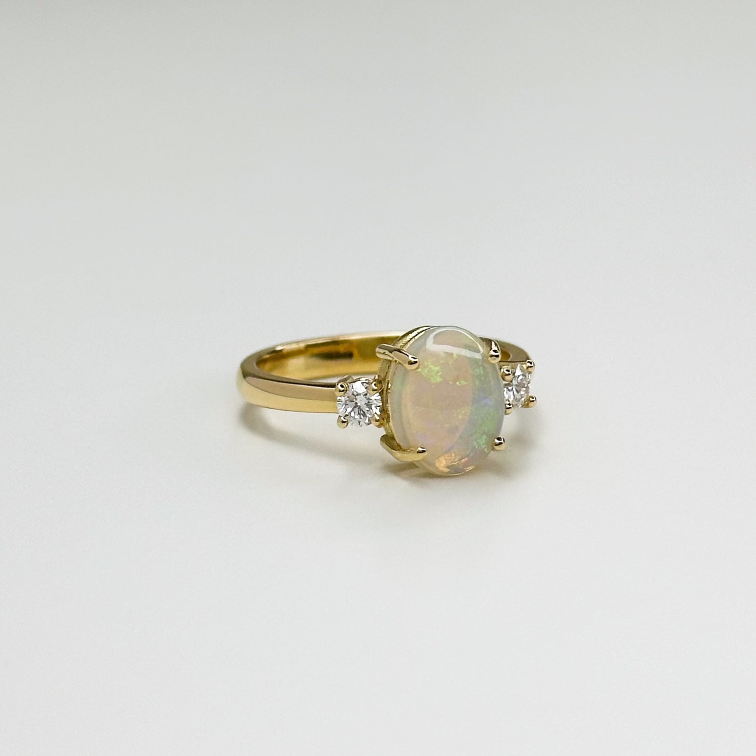 2.65ct Oval Opal and Diamond Trilogy Ring