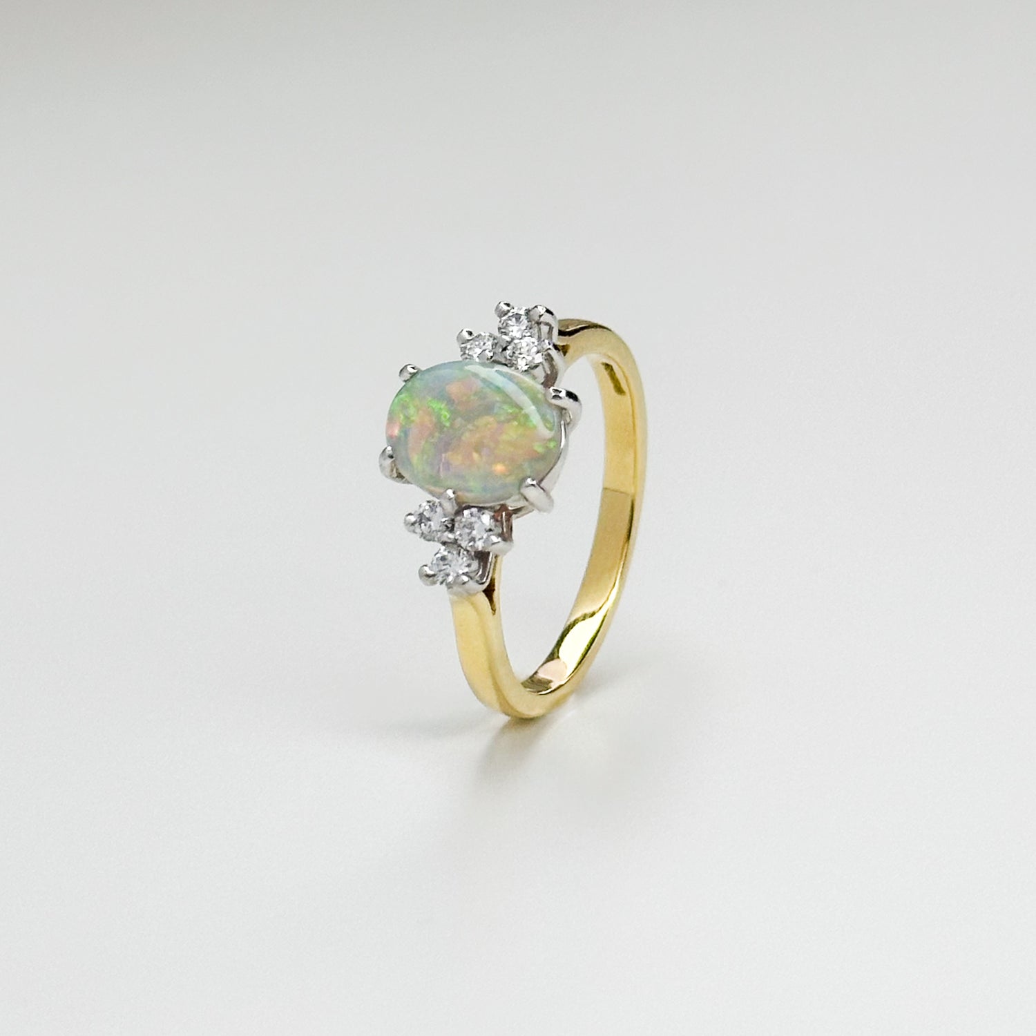 1.10ct Oval Opal and Diamond Ring