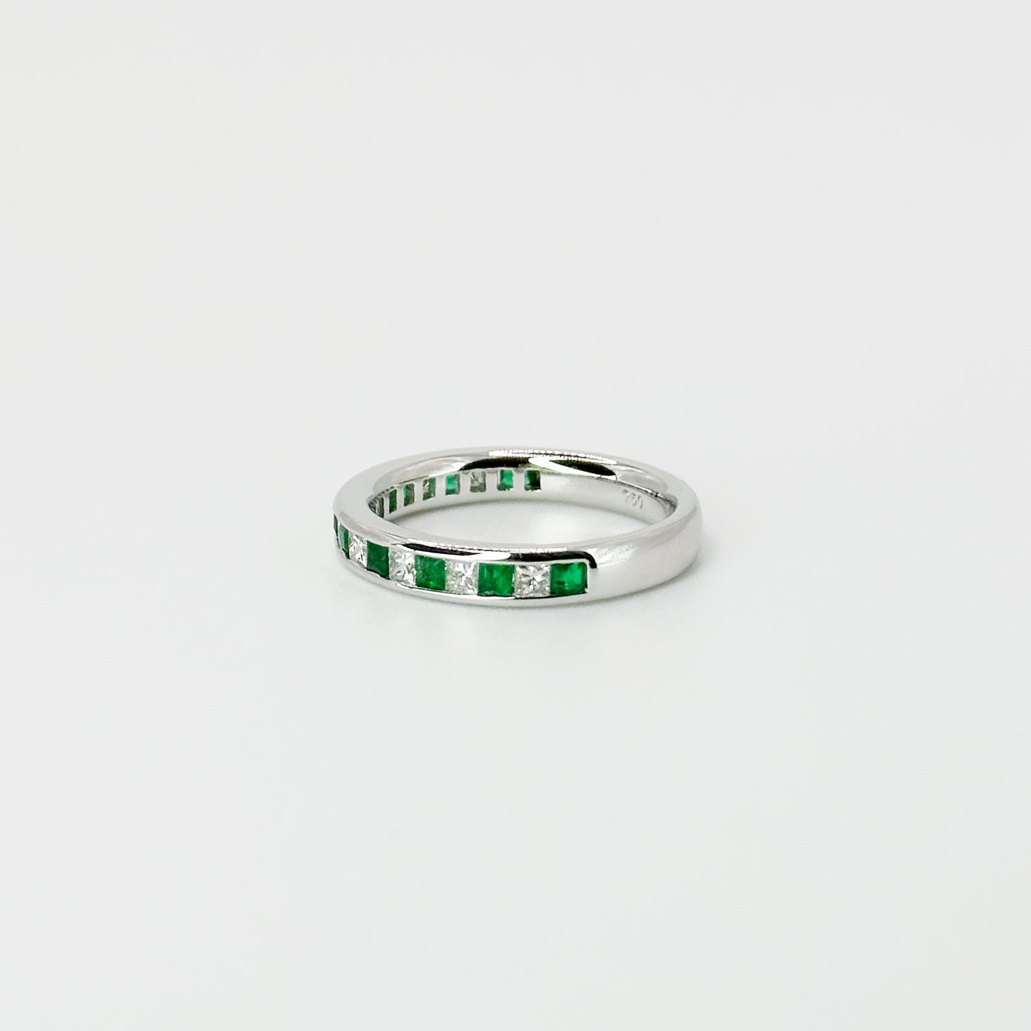 Diamond and Emerald Eternity Ring in White Gold
