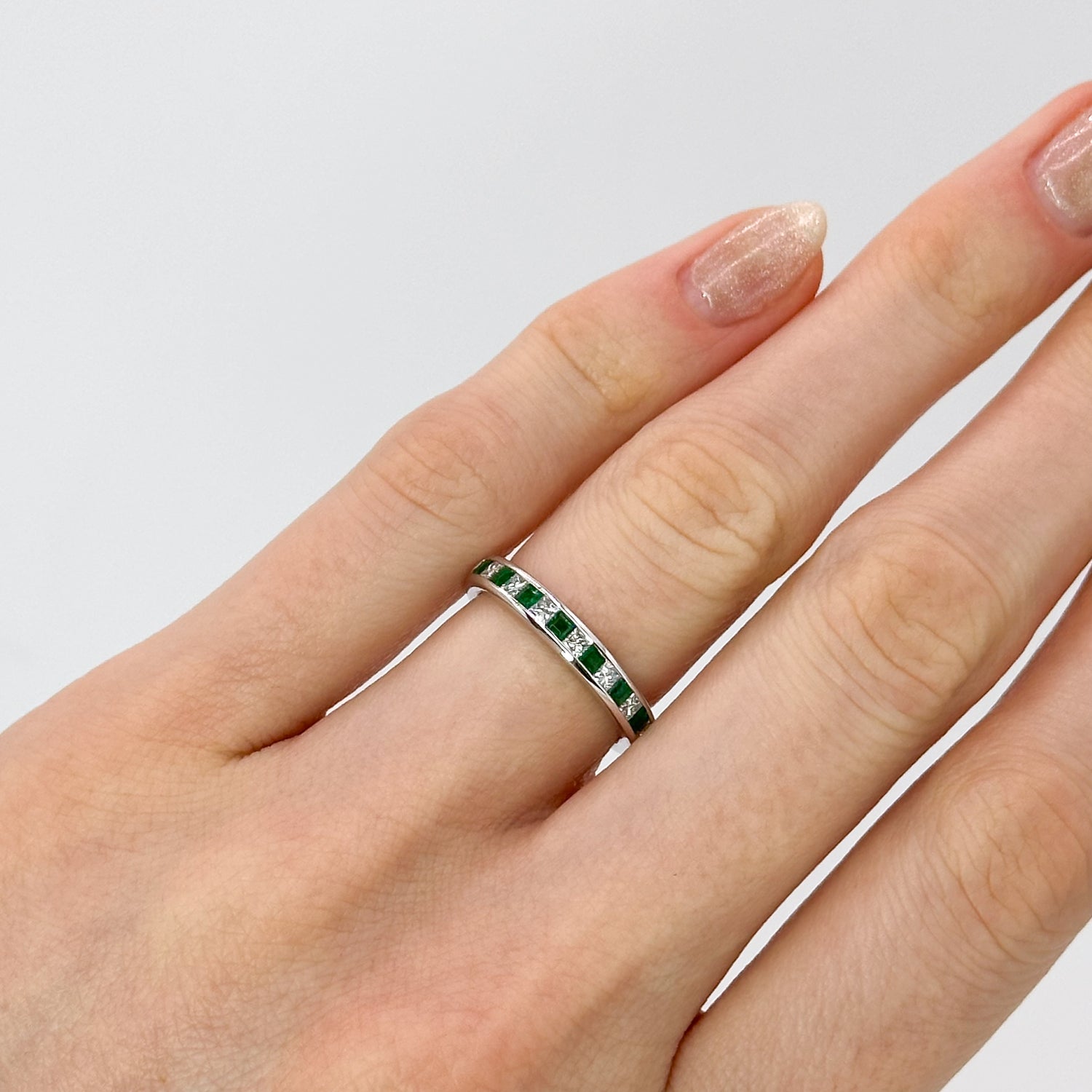 Diamond and Emerald Eternity Ring in White Gold