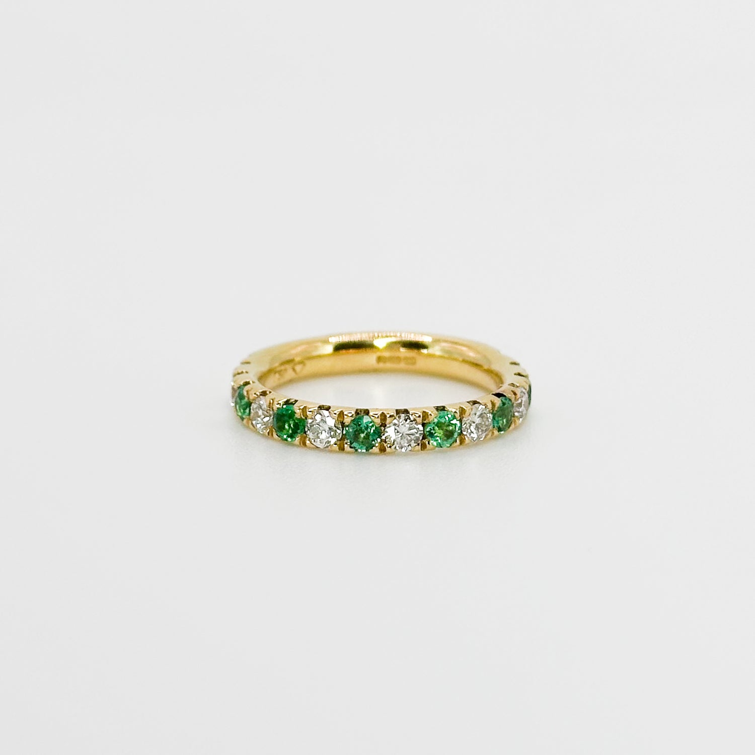 Diamond and Emerald Eternity Ring in Yellow Gold