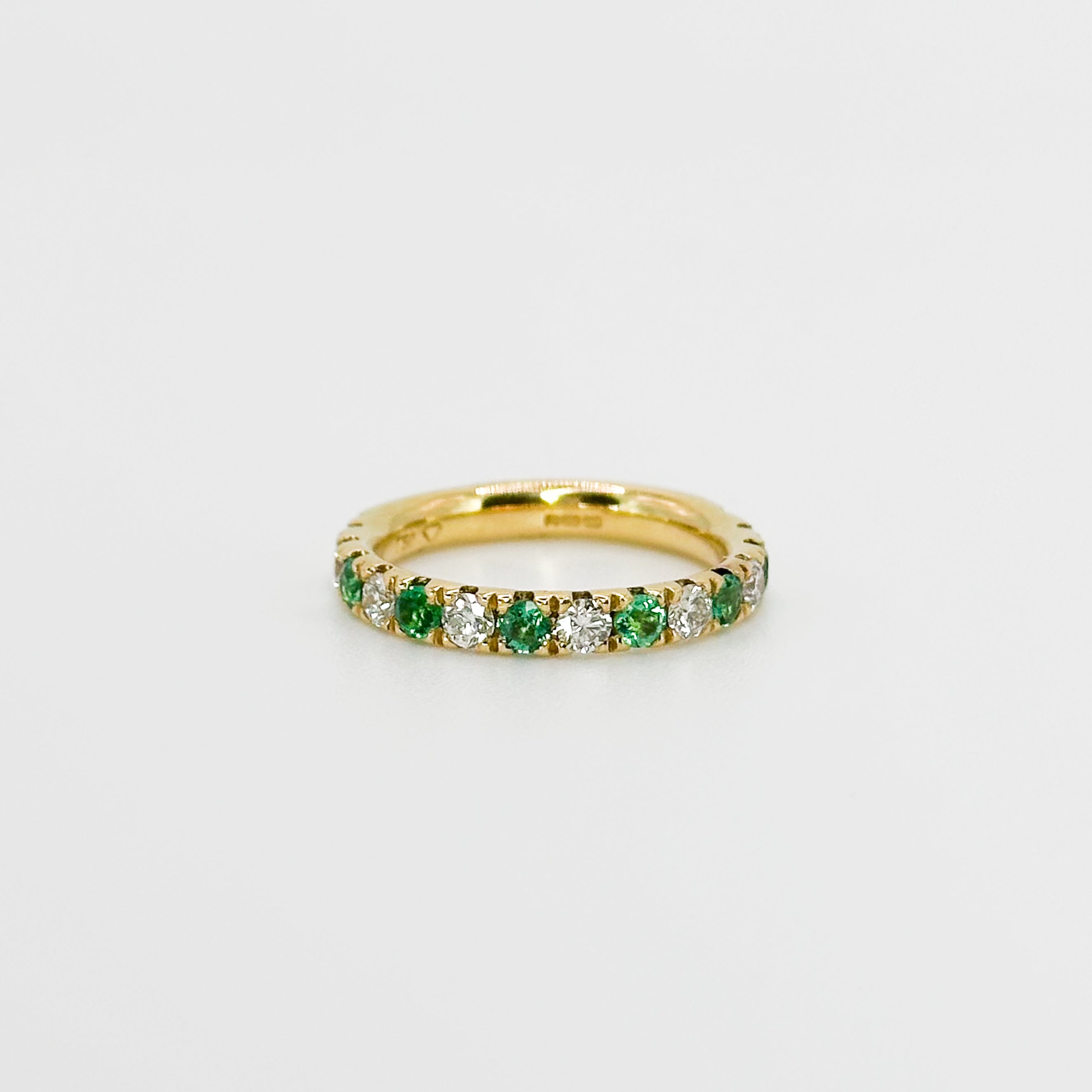 Diamond and Emerald Eternity Ring in Yellow Gold