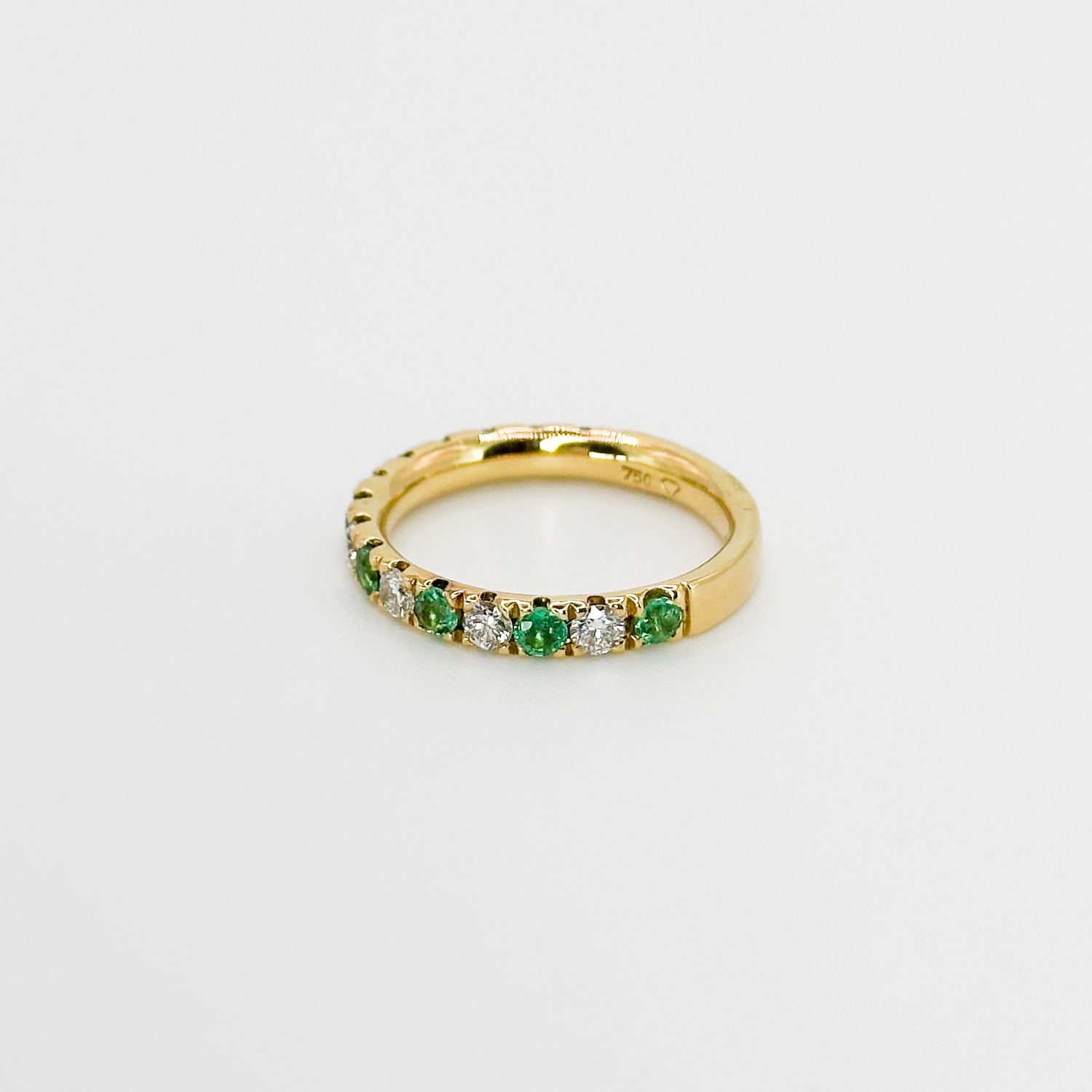 Diamond and Emerald Eternity Ring in Yellow Gold