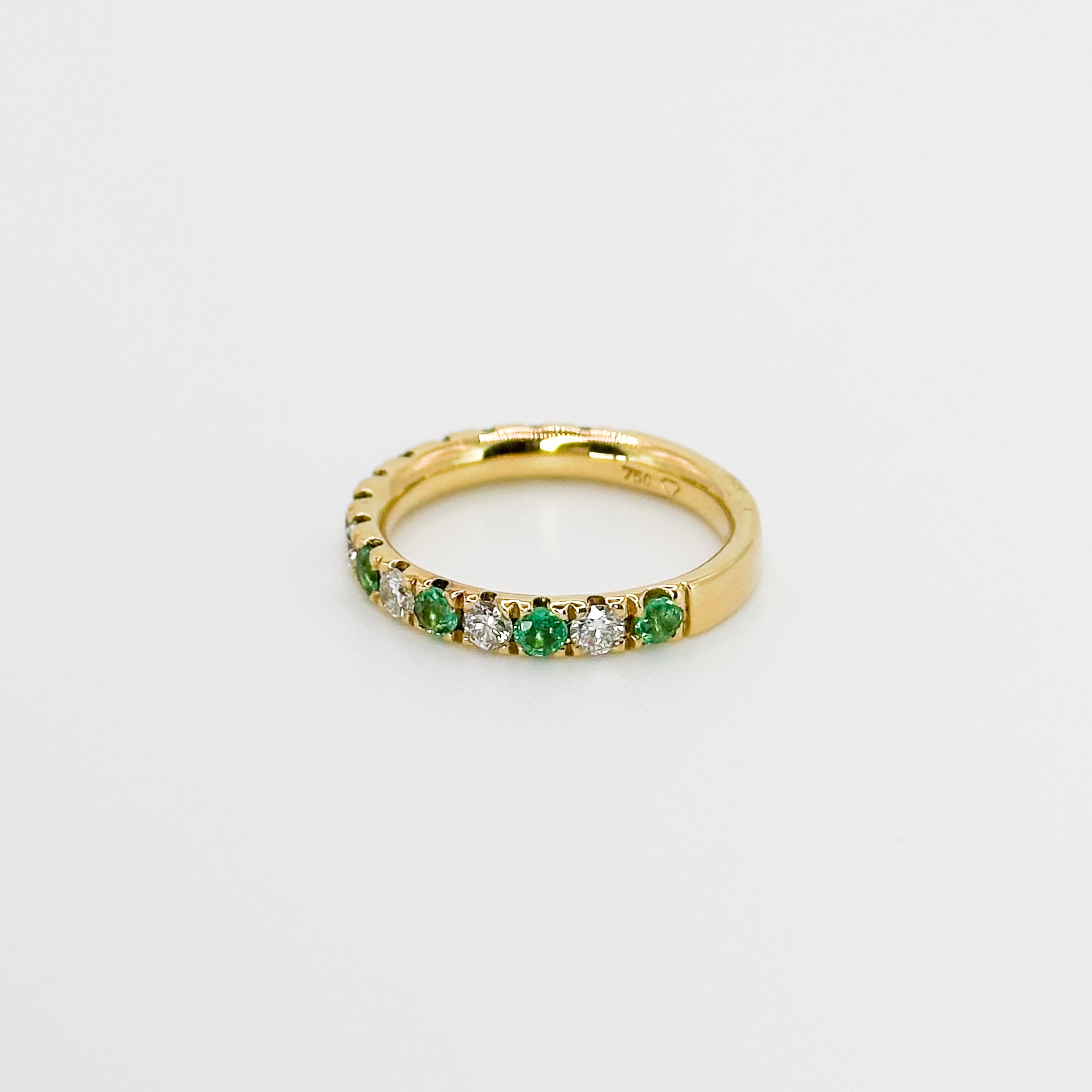 Diamond and Emerald Eternity Ring in Yellow Gold