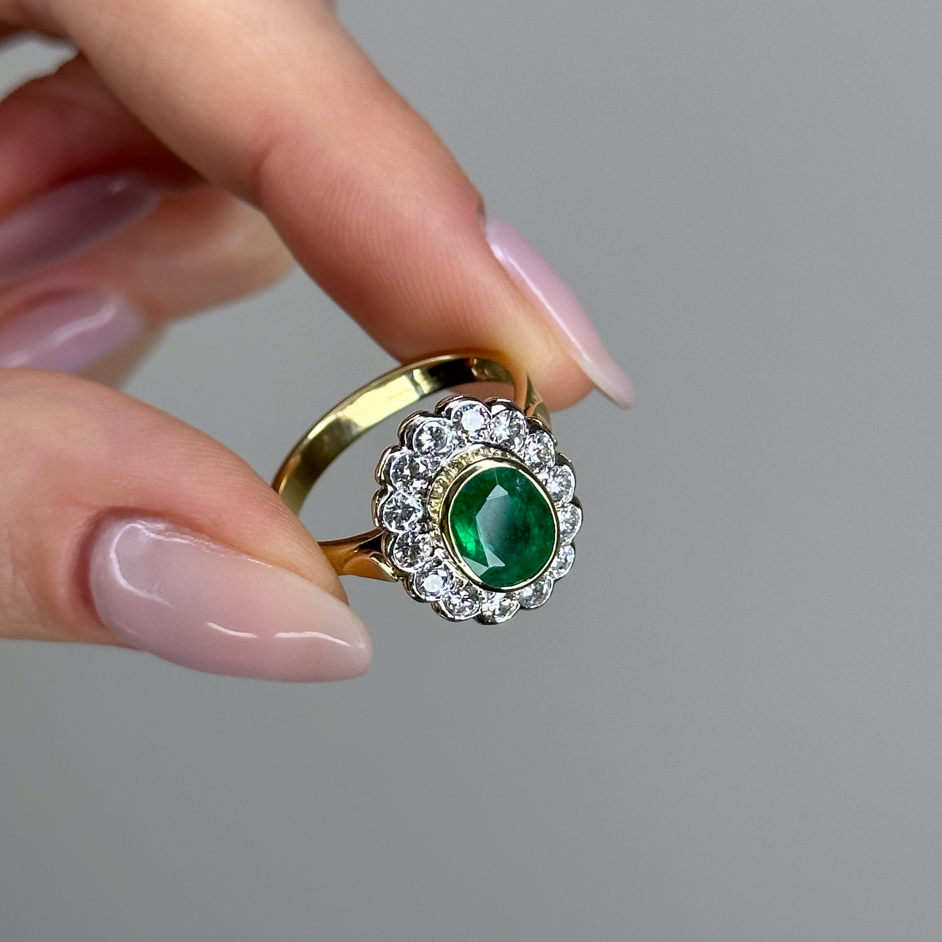 1.90ct Oval Emerald Ring with Bezel and Diamond Halo