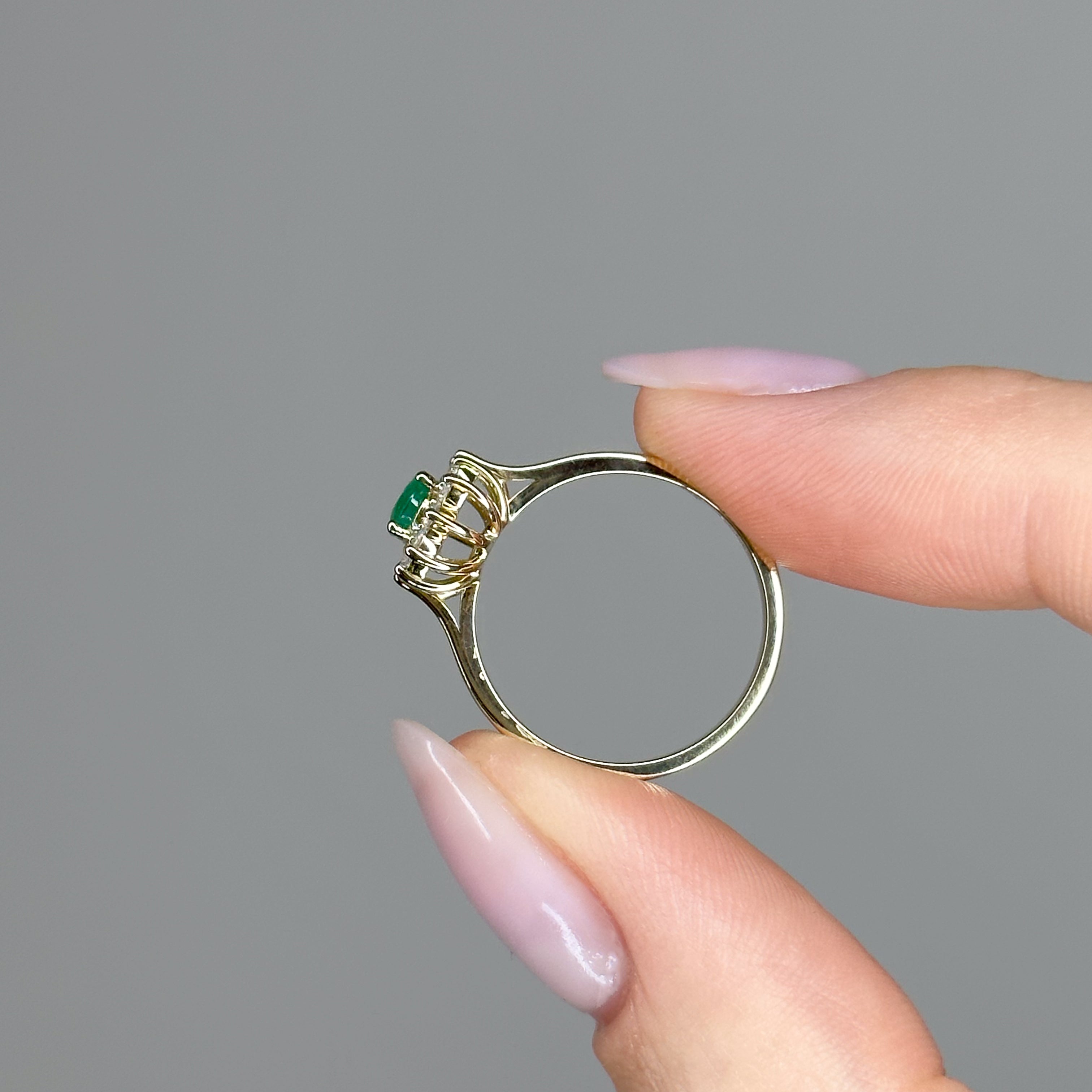 0.60ct Oval Shape Emerald Ring with a Diamond Halo