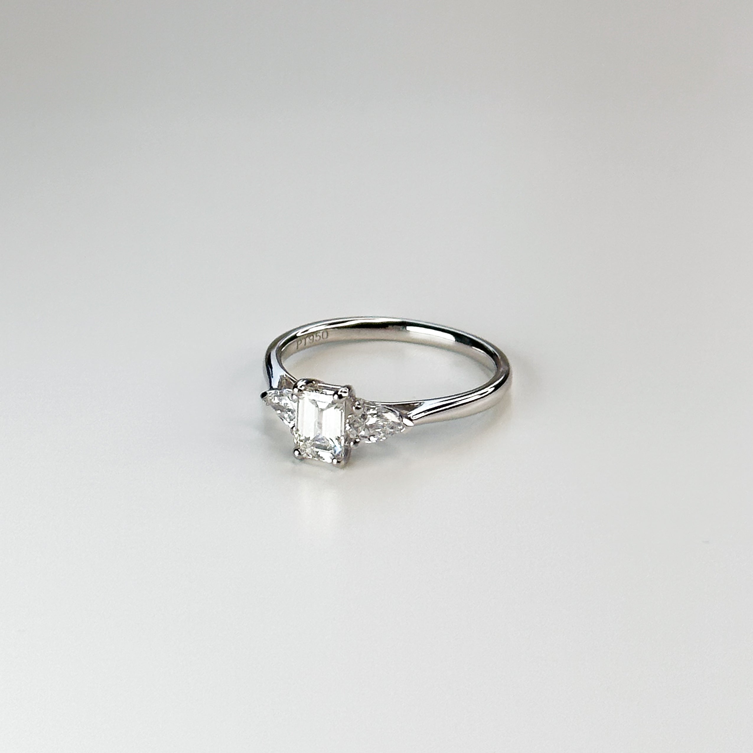 0.57ct GIA certified Emerald Cut Diamond Trilogy Ring
