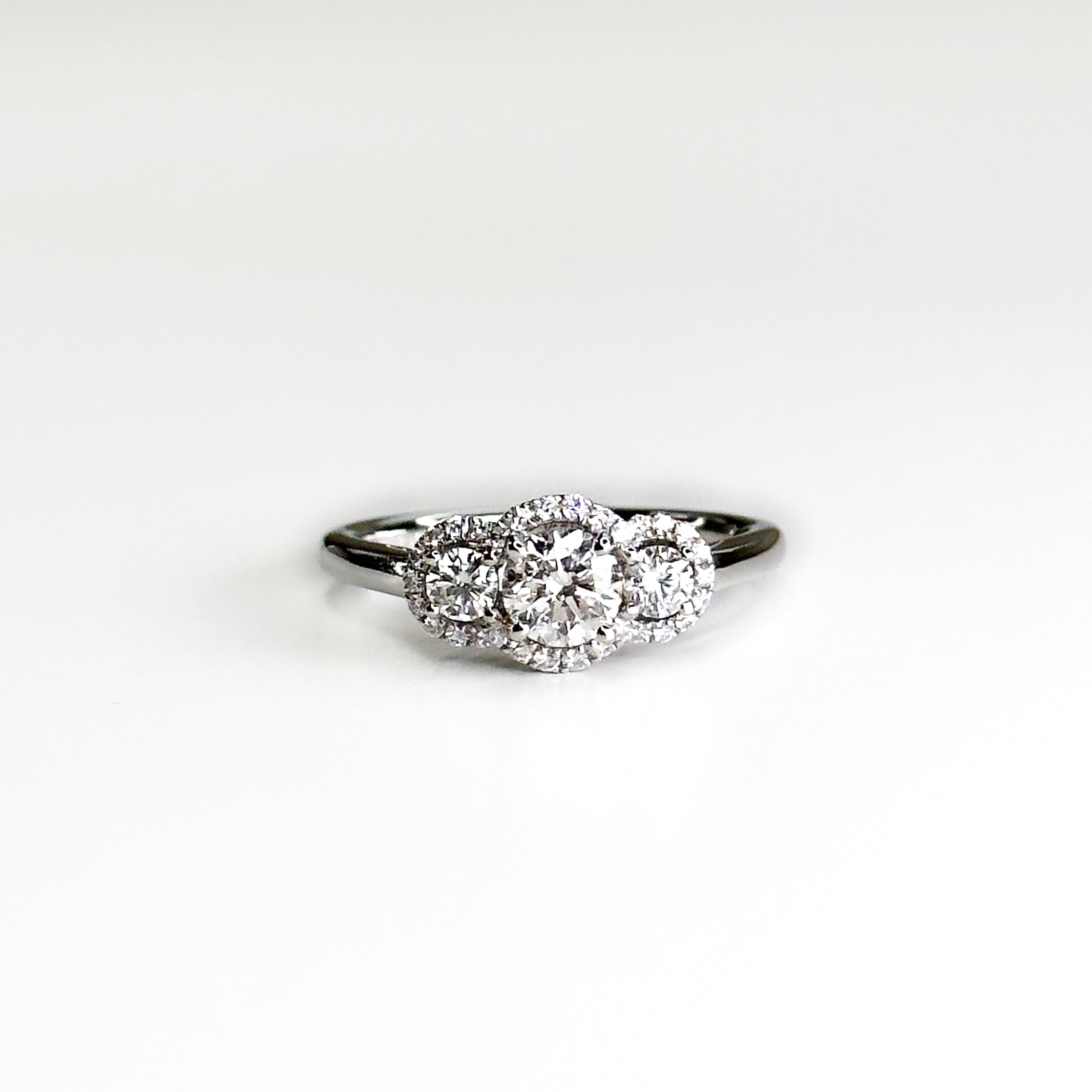 Diamond Trilogy Ring with 0.60ct Round Cut Stone
