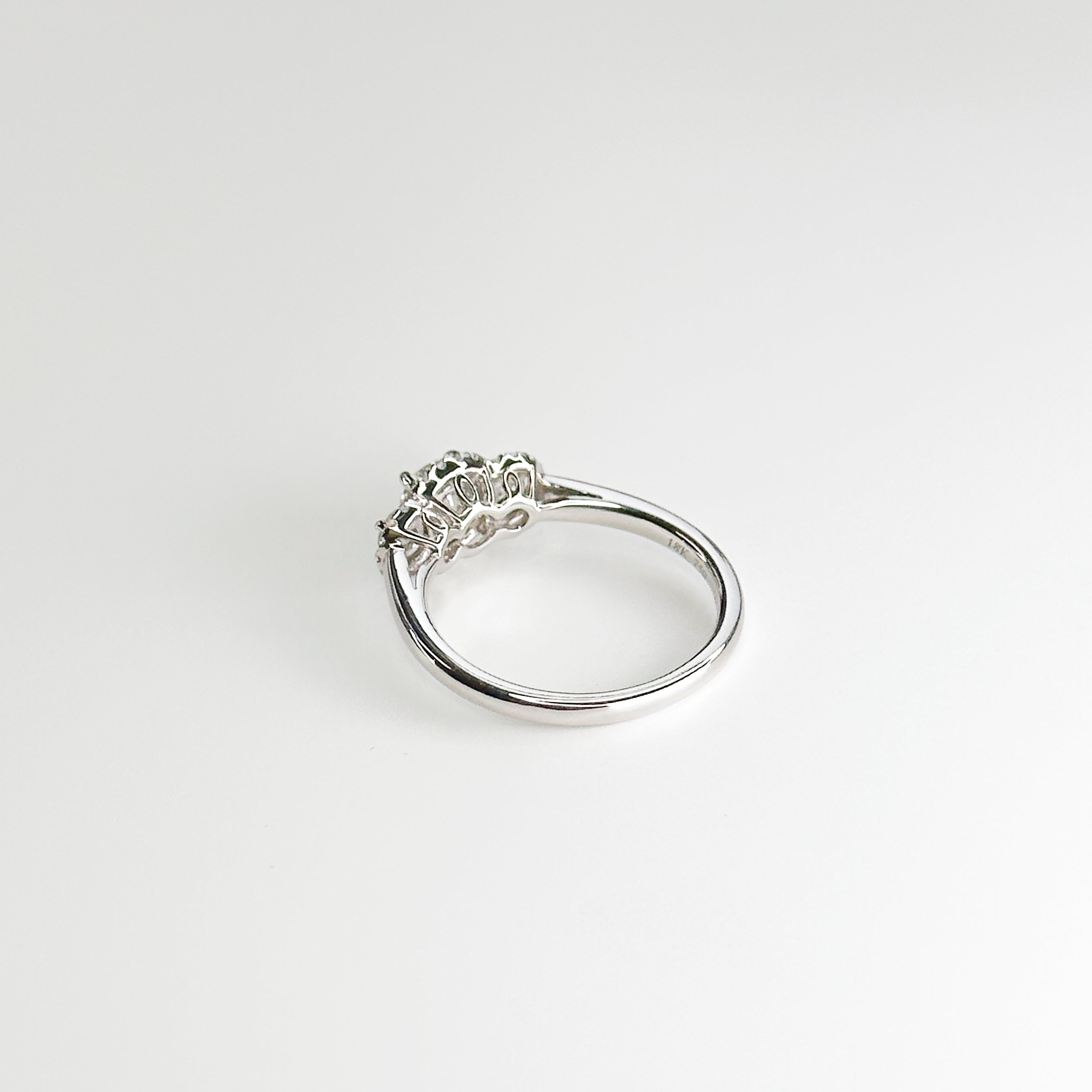 Diamond Trilogy Ring with 0.60ct Round Cut Stone