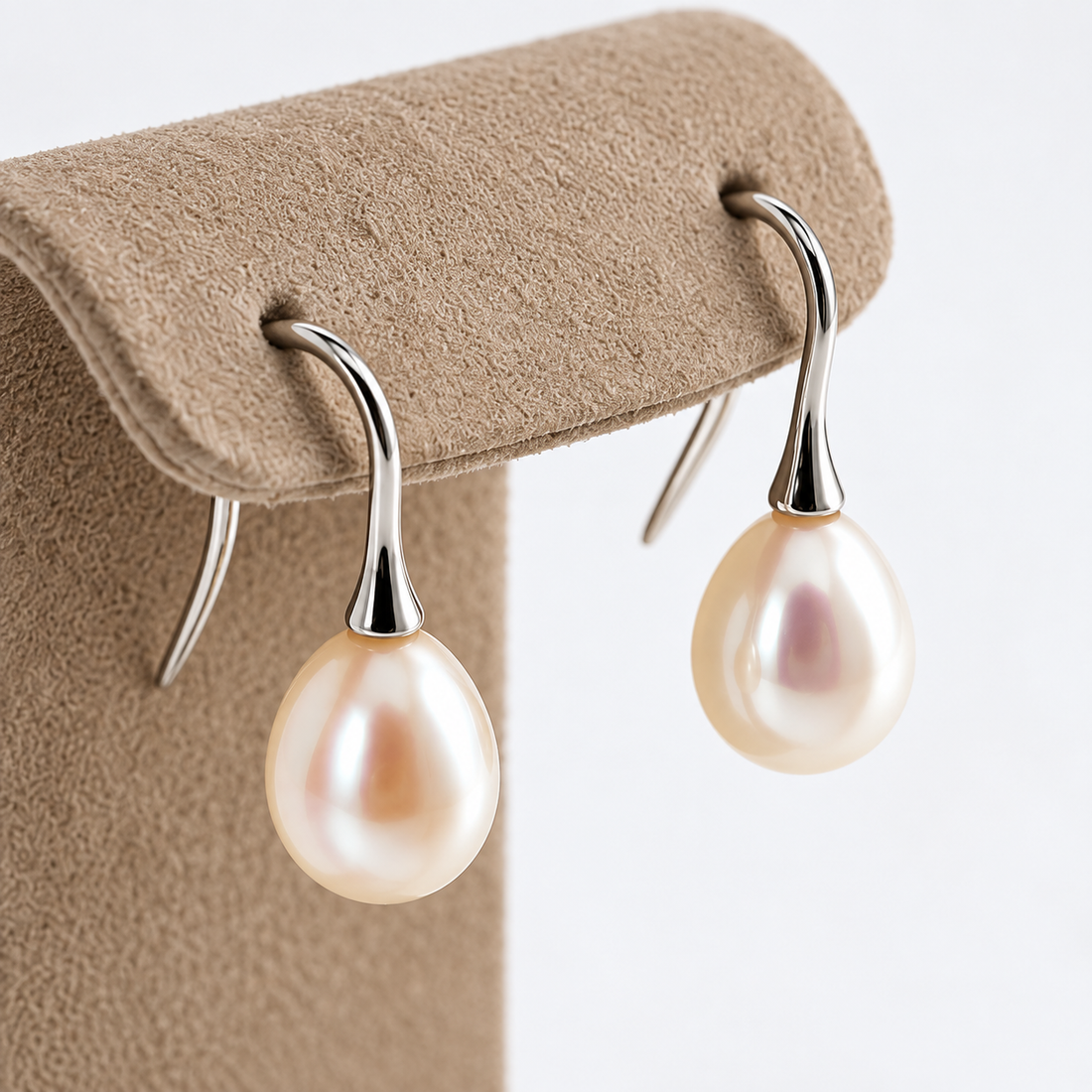 Pearl drop earrings in 18ct white gold - hanging display