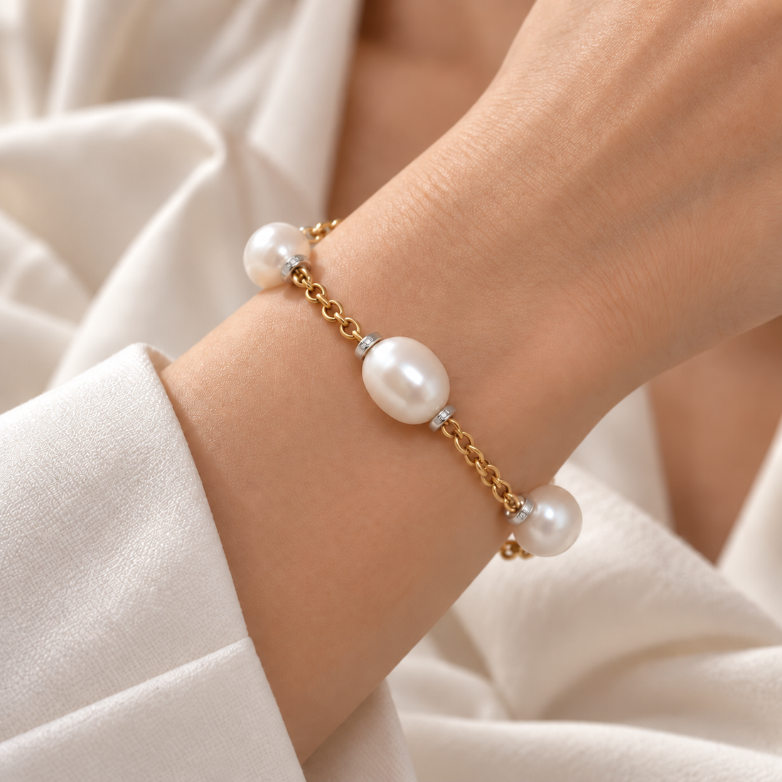 18ct yellow gold pearl and diamond bracelet worn on wrist