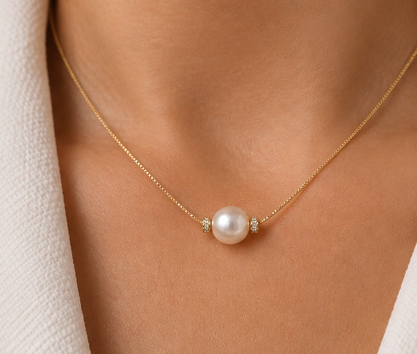 18ct yellow gold pearl and diamond necklace worn on neck