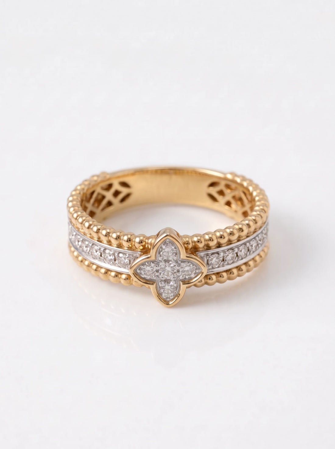 18ct yellow and white gold 0.31ct diamond clover dress ring, white background