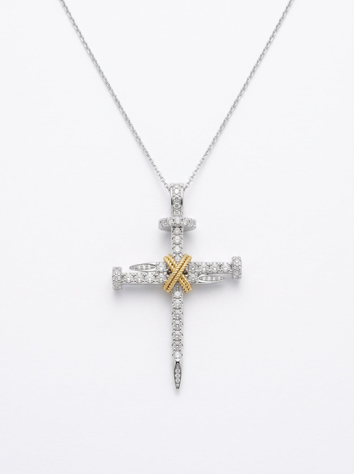 Close-up of GASIA 18ct two-tone diamond nail cross pendant