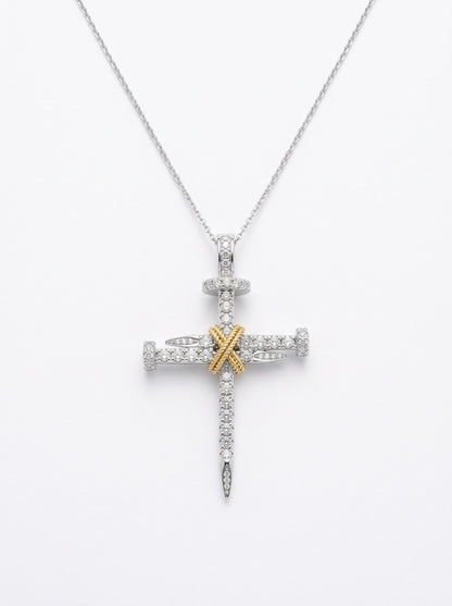 Close-up of GASIA 18ct two-tone diamond nail cross pendant