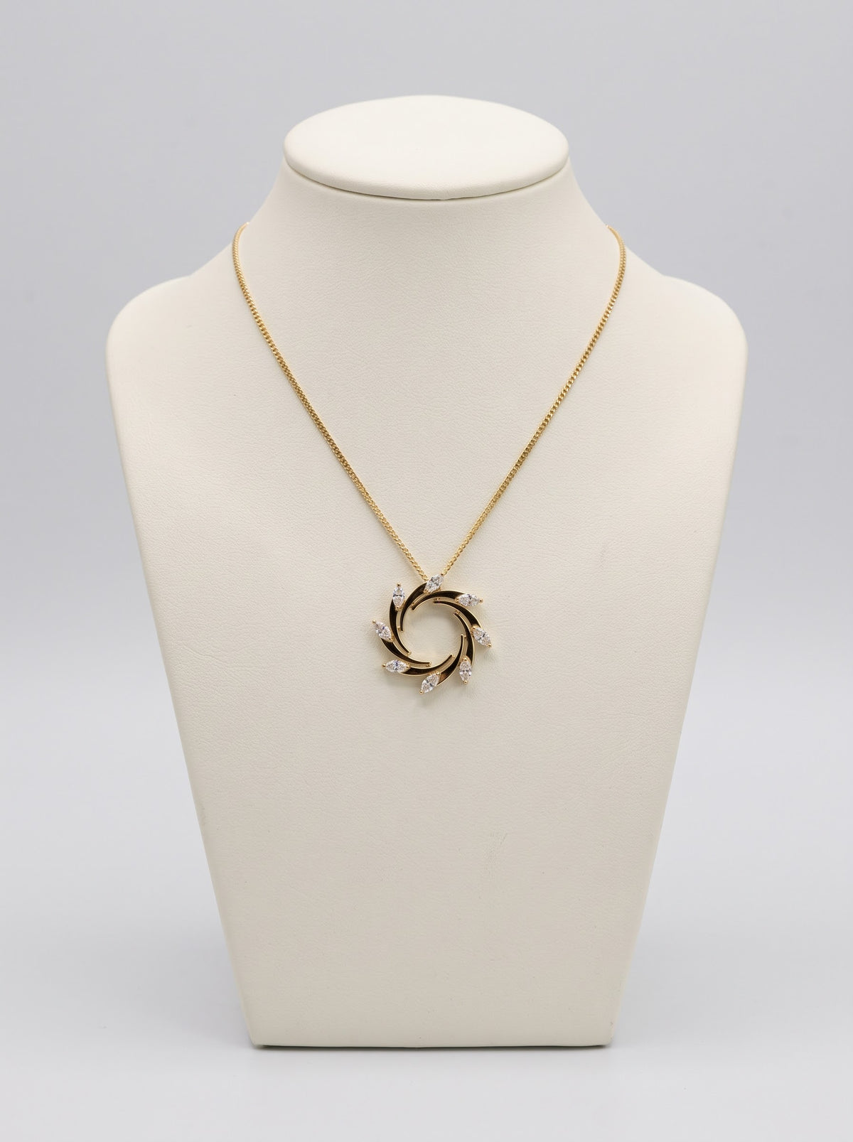 18ct yellow gold 0.79ct diamond swirl necklace on ivory jewellery bust