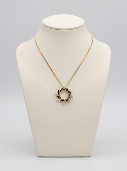 18ct yellow gold 0.79ct diamond swirl necklace on ivory jewellery bust