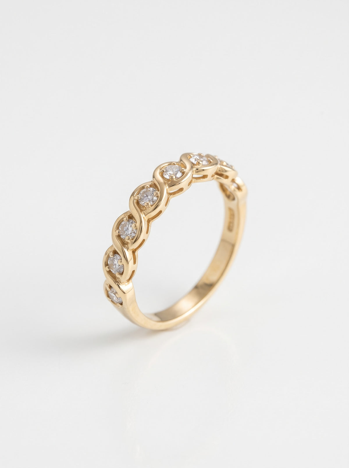 Pre-owned 18ct yellow gold seven-stone 0.37ct diamond ring isolated on white