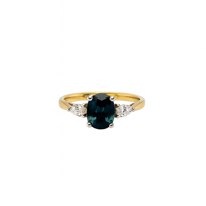 Oval cut Teal sapphire with pear diamonds