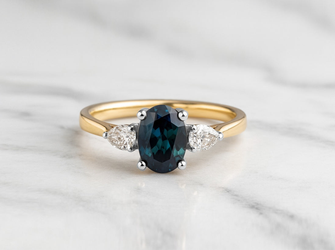 Oval cut Teal sapphire with pear diamonds