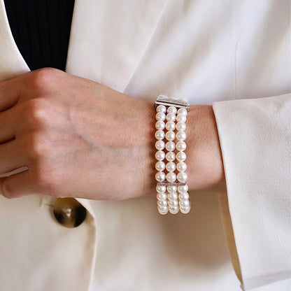 white pearl bracelet with gold and diamonds