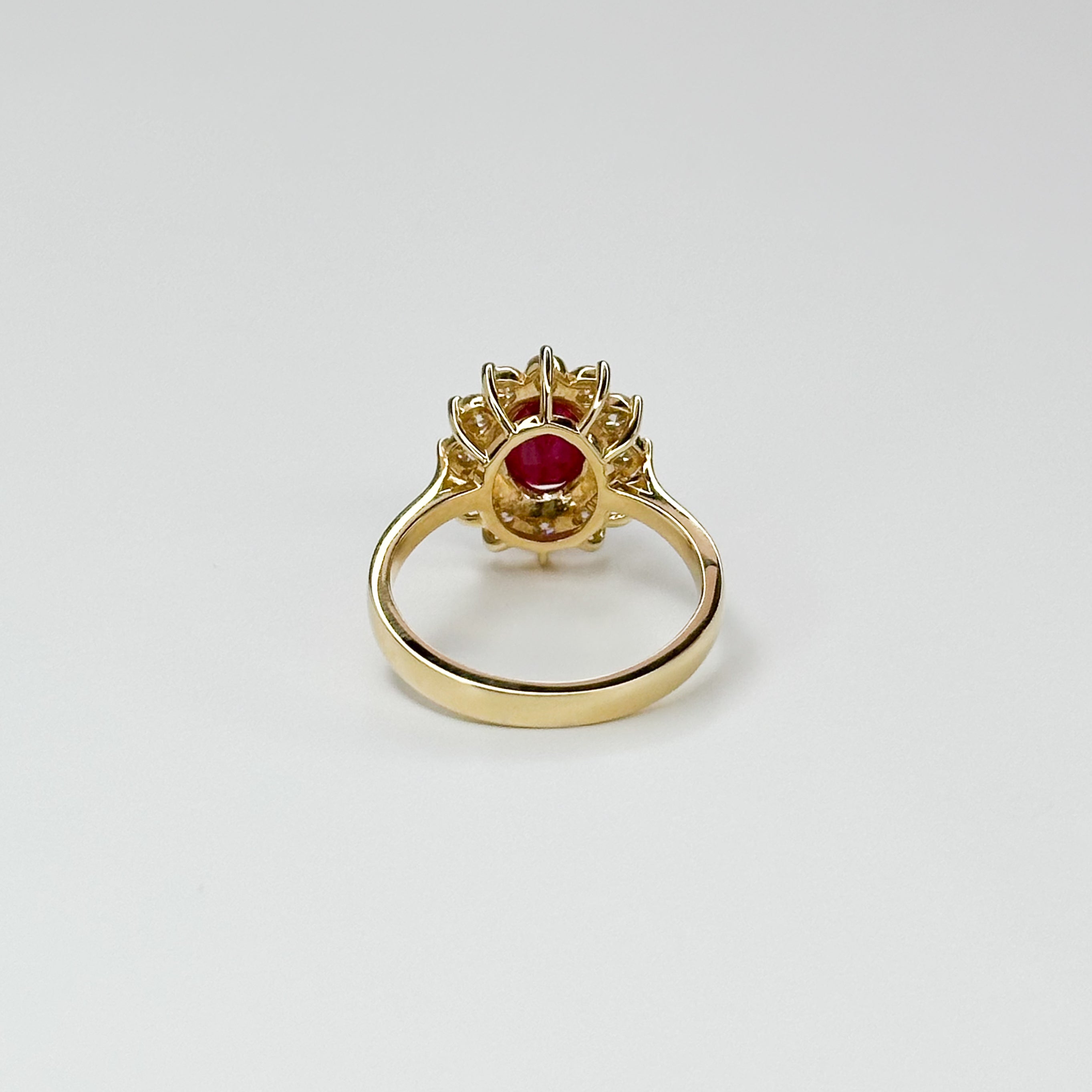 1.70ct Oval Cut Ruby Ring with Diamond Halo