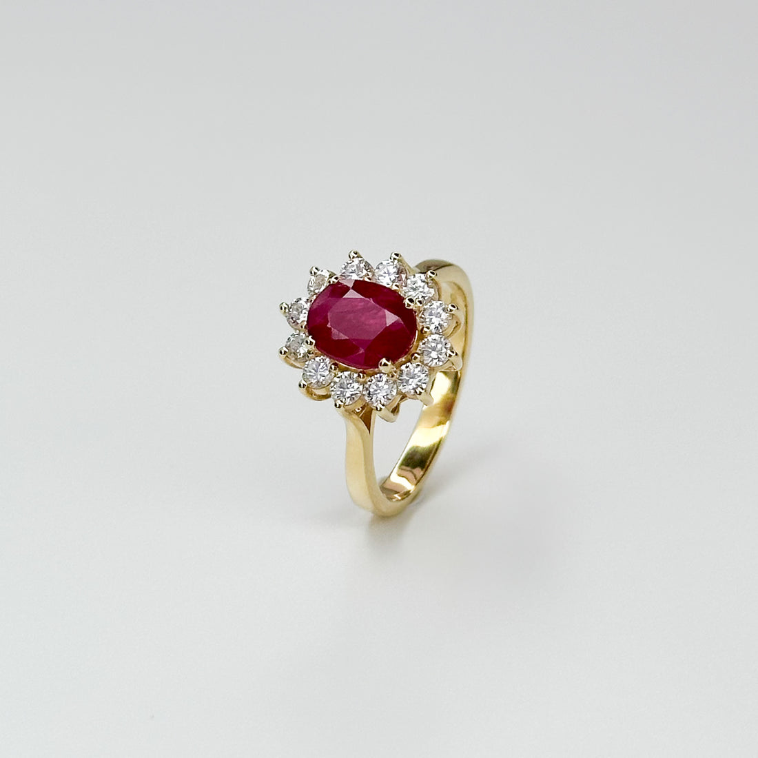 1.70ct Oval Cut Ruby Ring with Diamond Halo