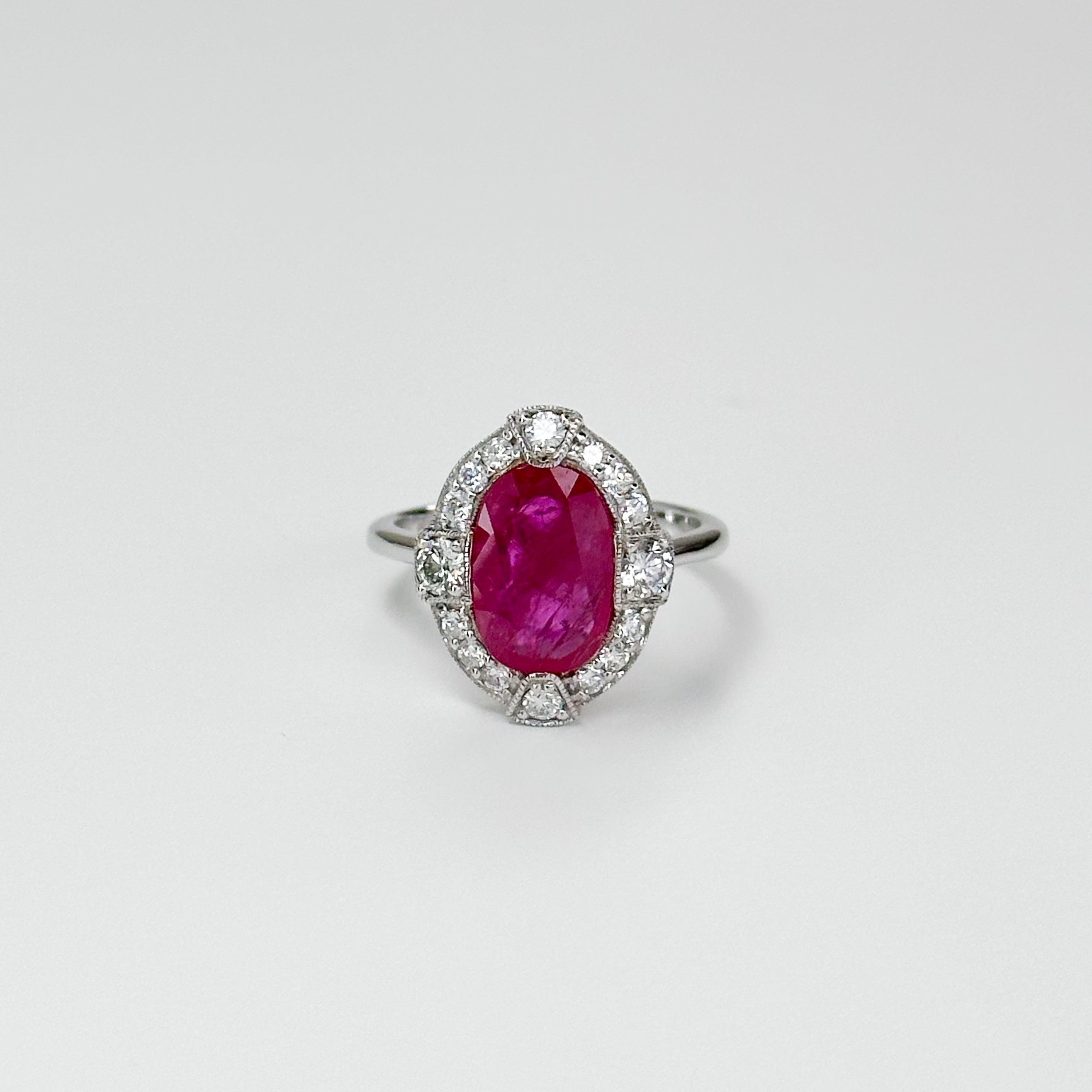 3.23ct Oval Cut Ruby Ring with Diamond Halo