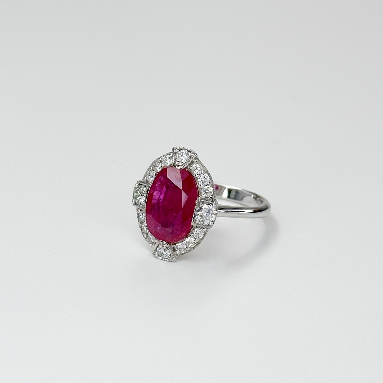 3.23ct Oval Cut Ruby Ring with Diamond Halo