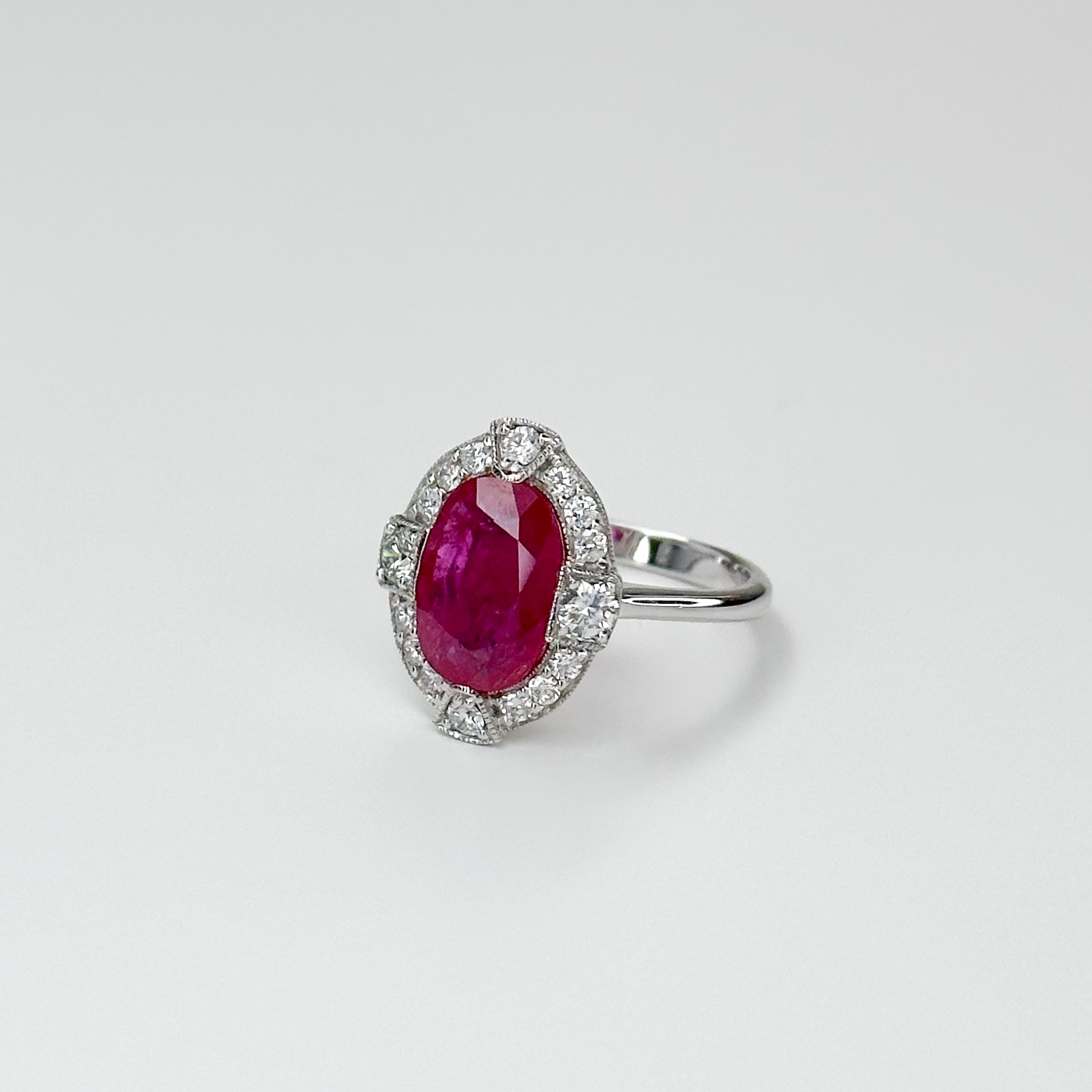 3.23ct Oval Cut Ruby Ring with Diamond Halo
