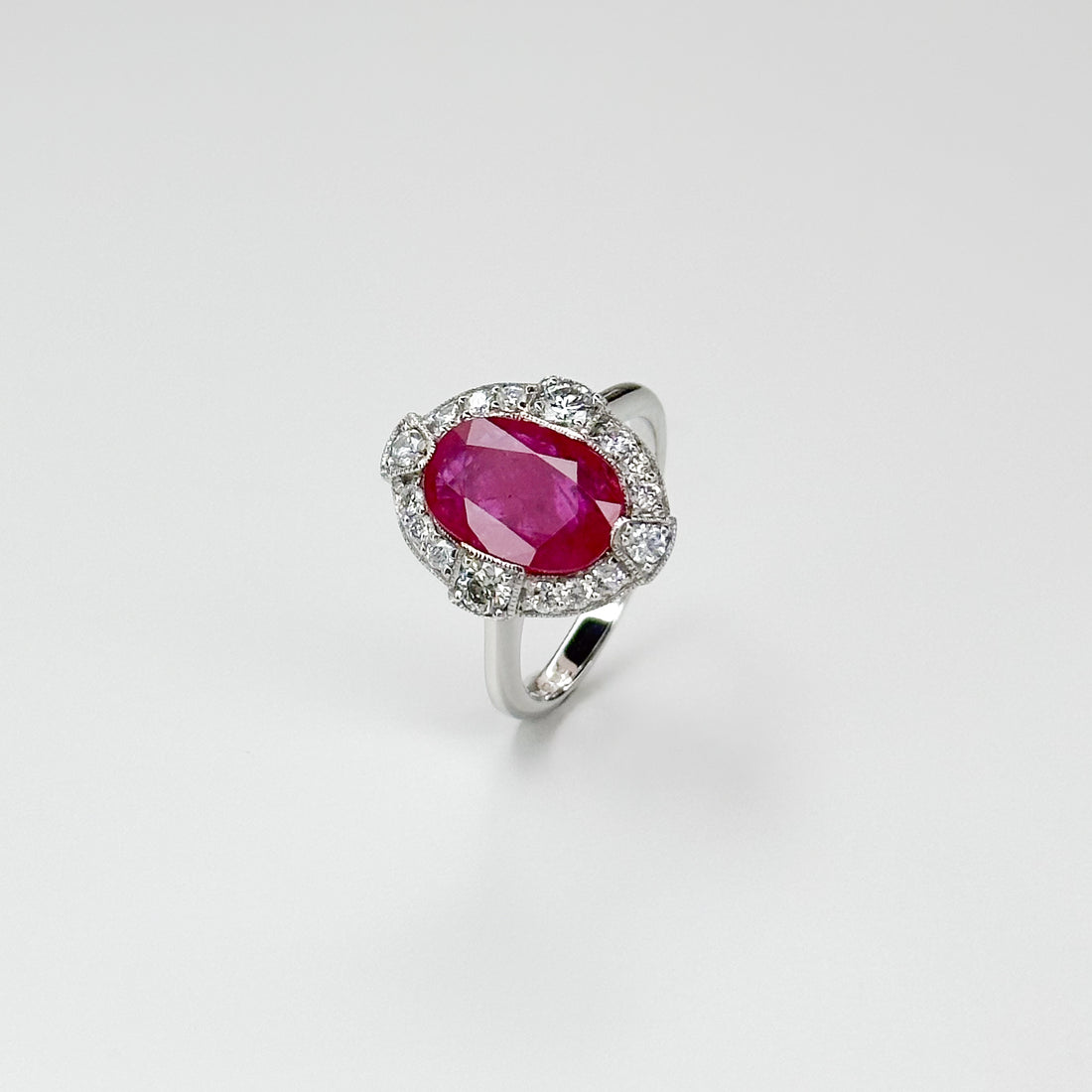 3.23ct Oval Cut Ruby Ring with Diamond Halo