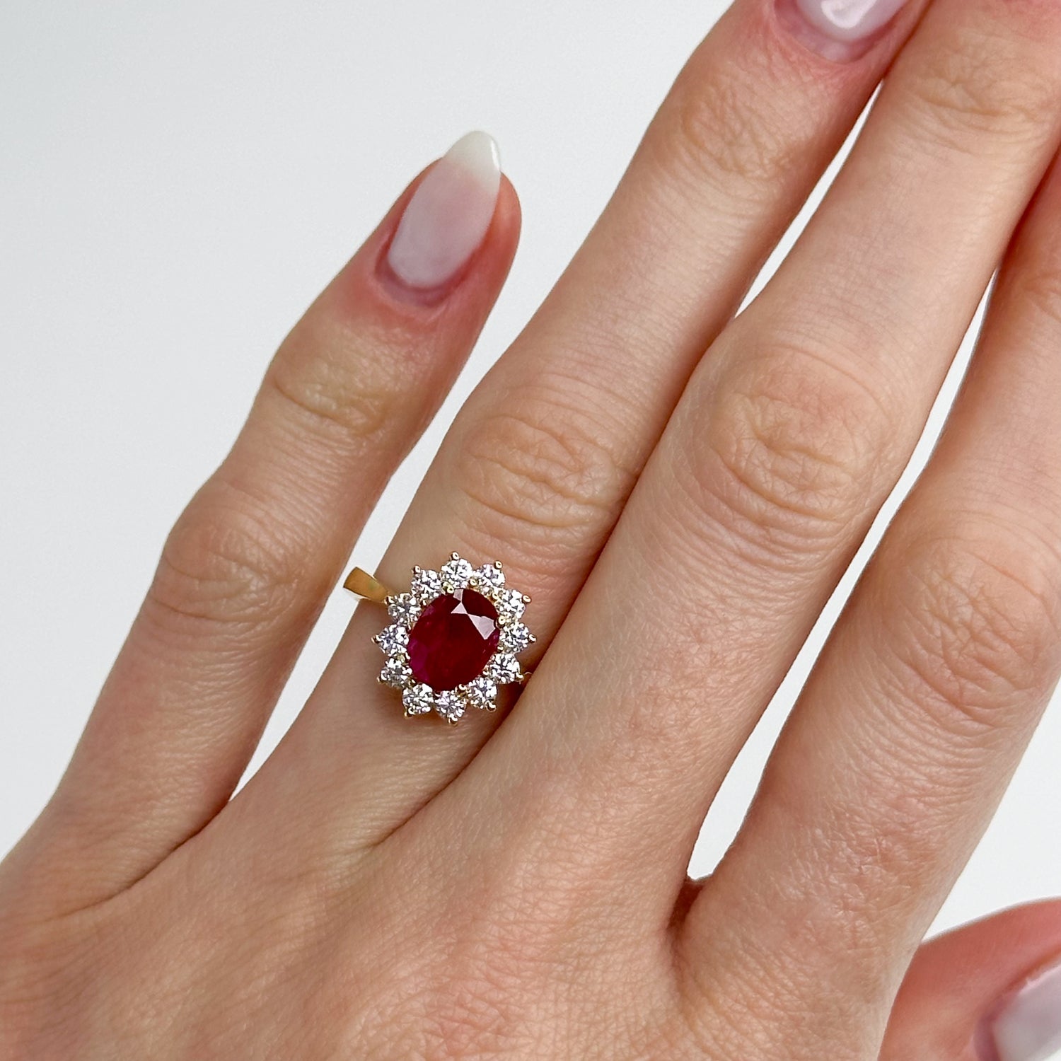 1.70ct Oval Cut Ruby Ring with Diamond Halo