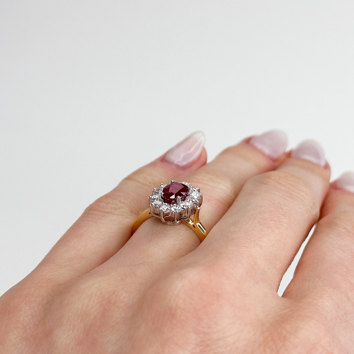 1.05ct Oval Cut Ruby Ring with Diamond Halo