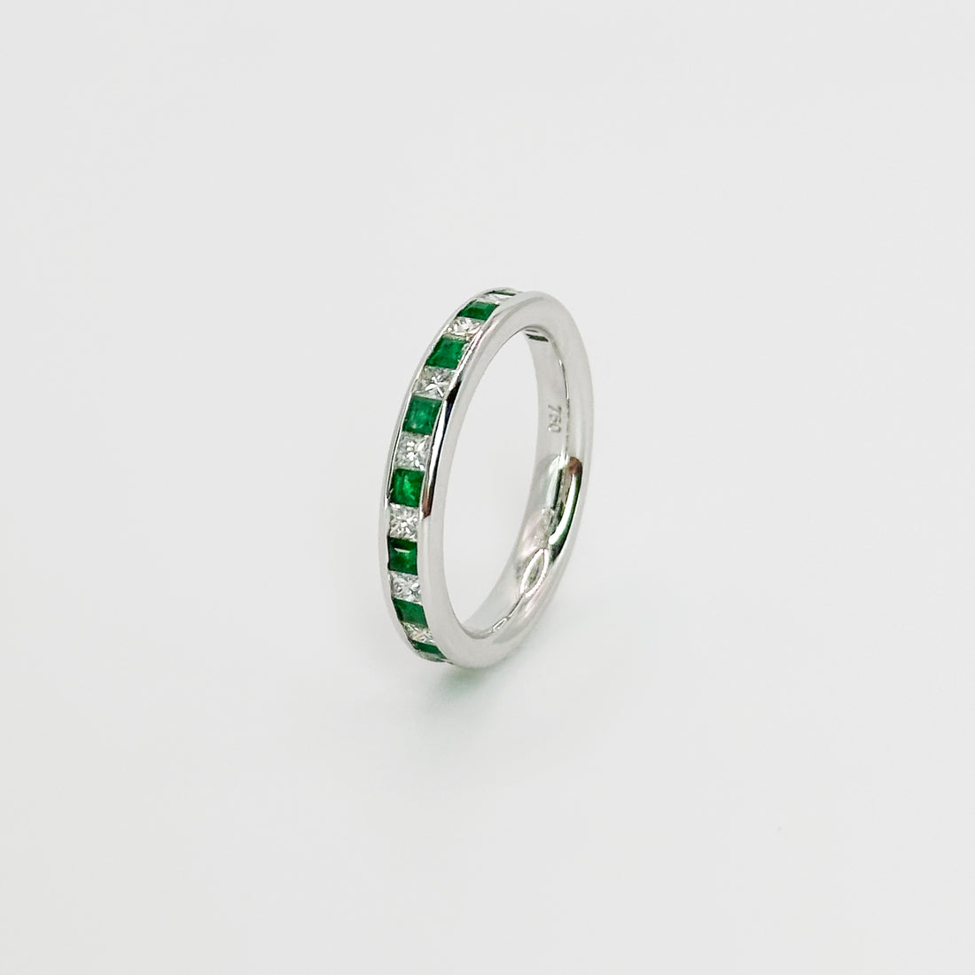 Diamond and Emerald Eternity Ring in White Gold