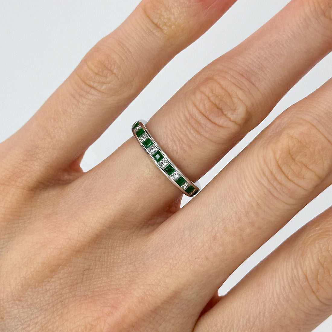 Diamond and Emerald Eternity Ring in White Gold