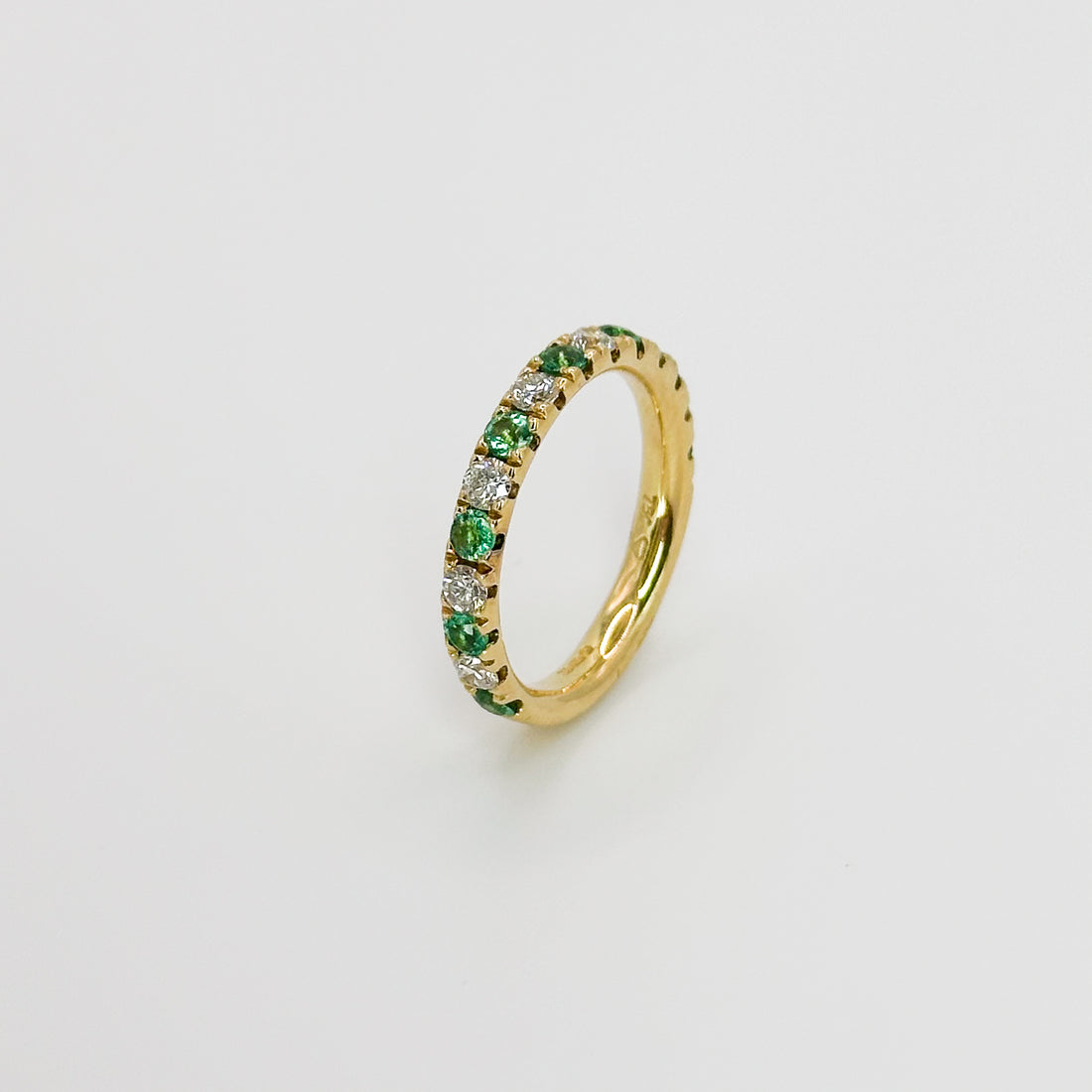 Diamond and Emerald Eternity Ring in Yellow Gold