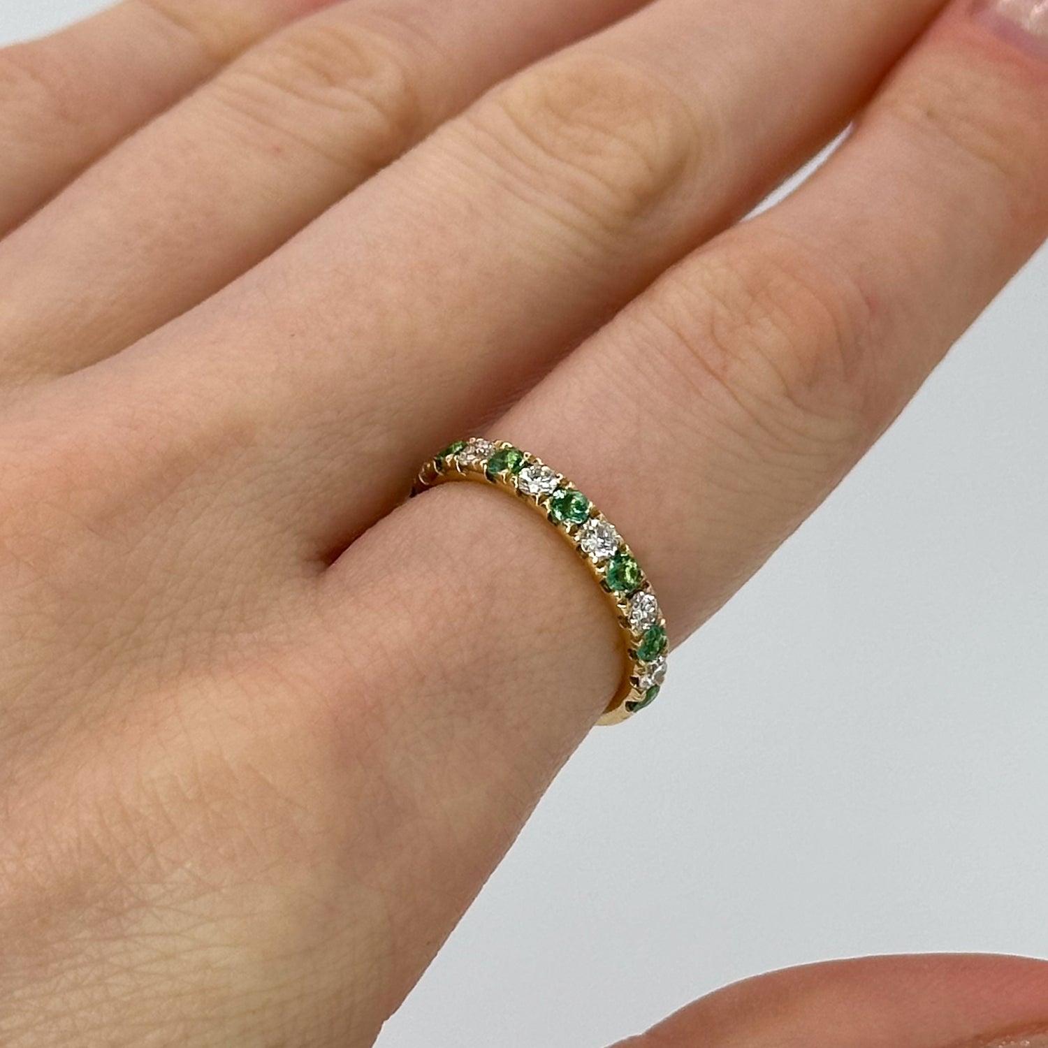 Diamond and Emerald Eternity Ring in Yellow Gold