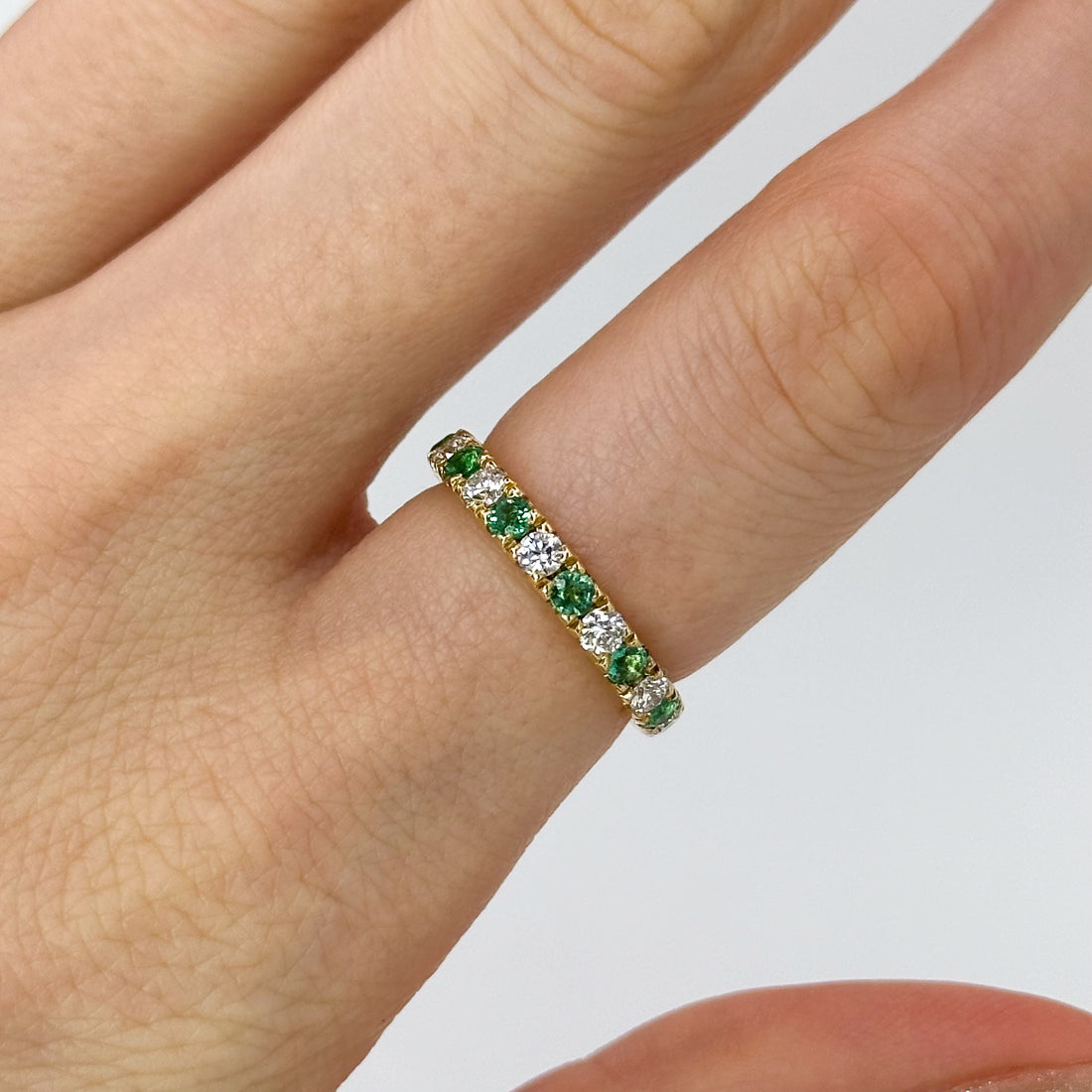 Diamond and Emerald Eternity Ring in Yellow Gold