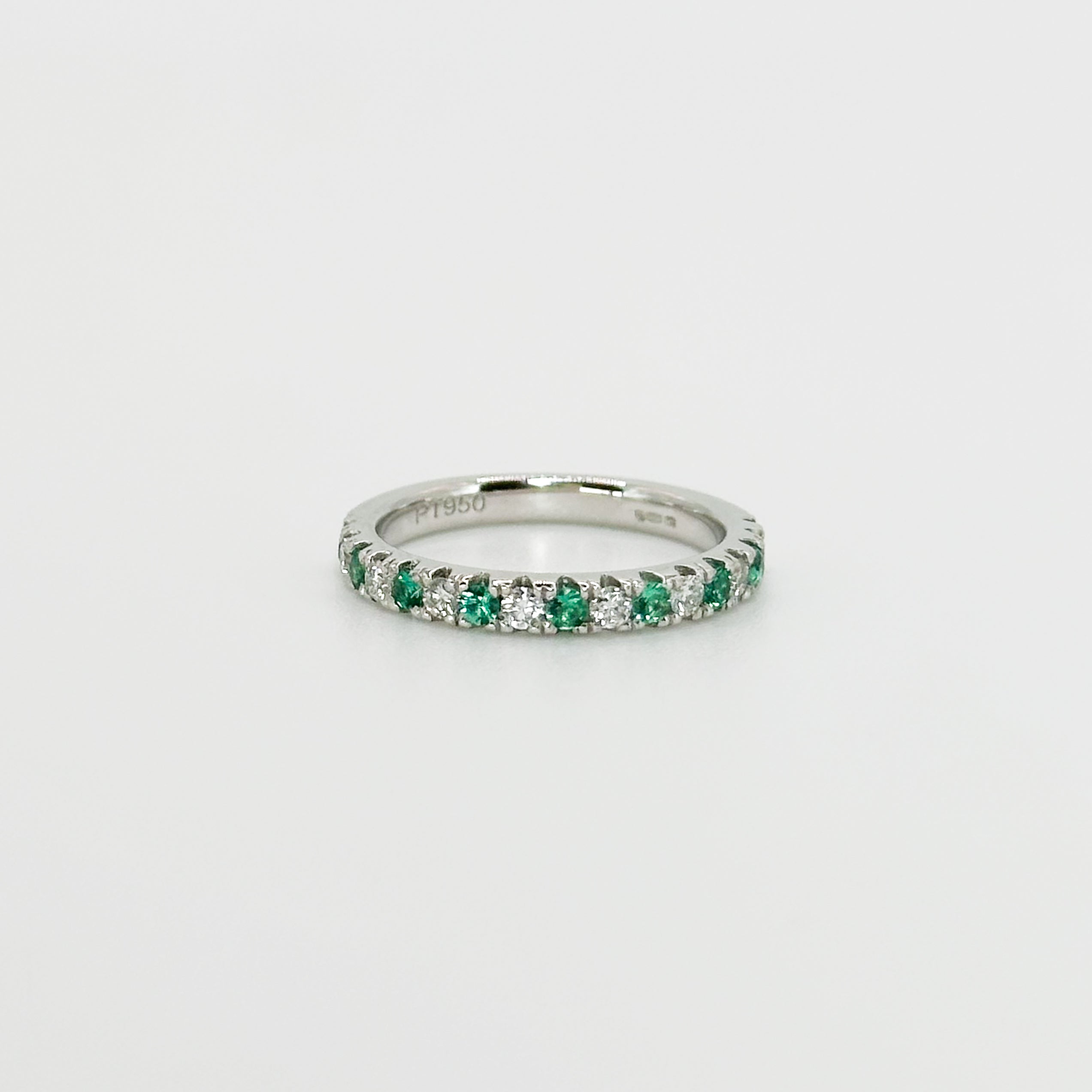 Diamond and Emerald Eternity Ring in Platinum