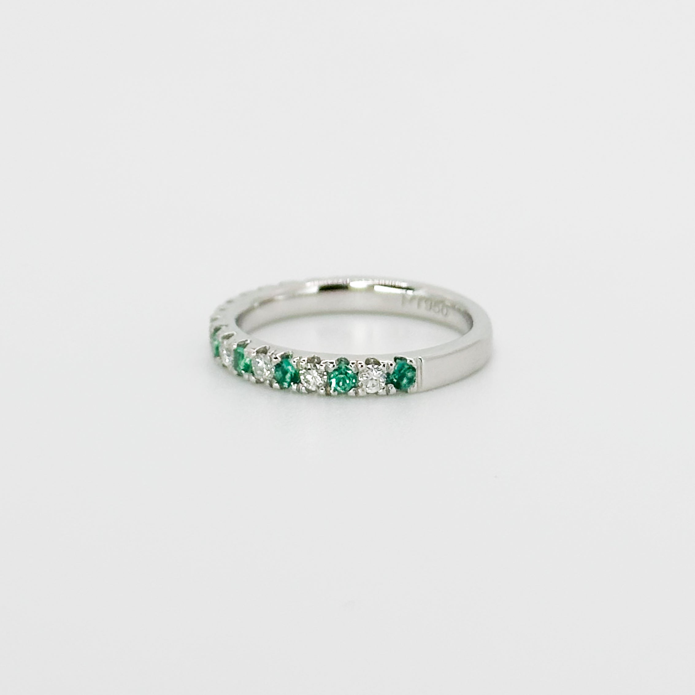 Diamond and Emerald Eternity Ring in Platinum