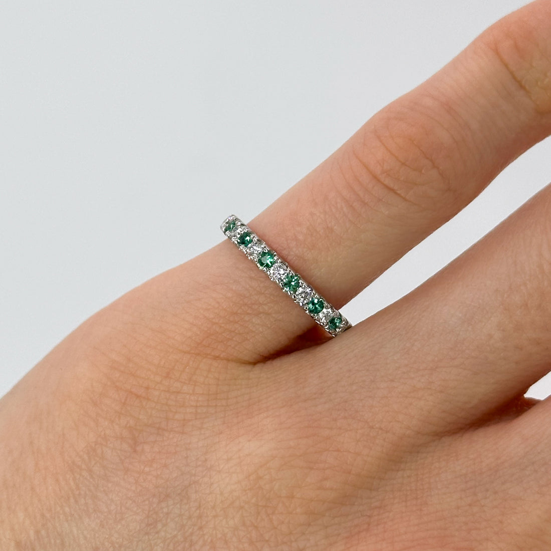 Diamond and Emerald Eternity Ring in Platinum