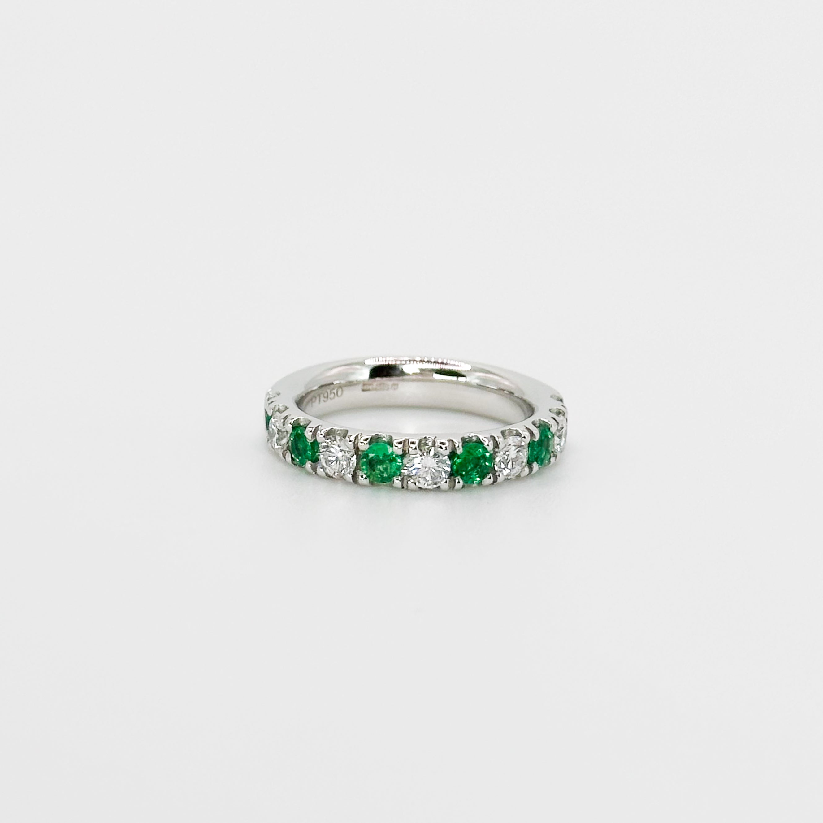 Diamond and Emerald Eternity Ring in Platinum