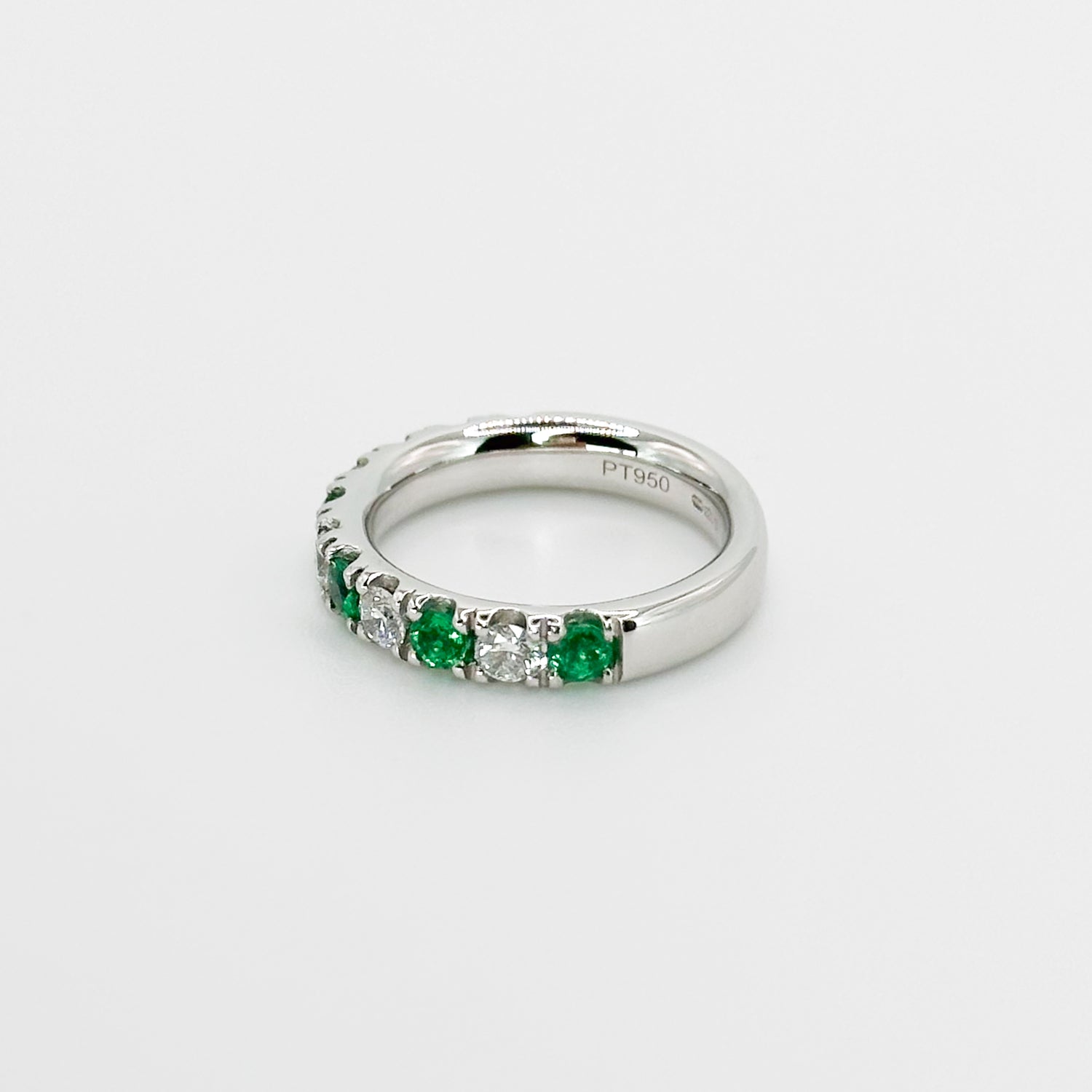 Diamond and Emerald Eternity Ring in Platinum